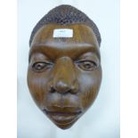 An African hardwood carved face plaque