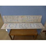 Two reproduction wooden circus signs