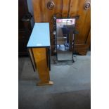 A cast metal mirror and a Formica drop-leaf kitchen table