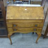 A Queen Anne style walnut bureau de dame