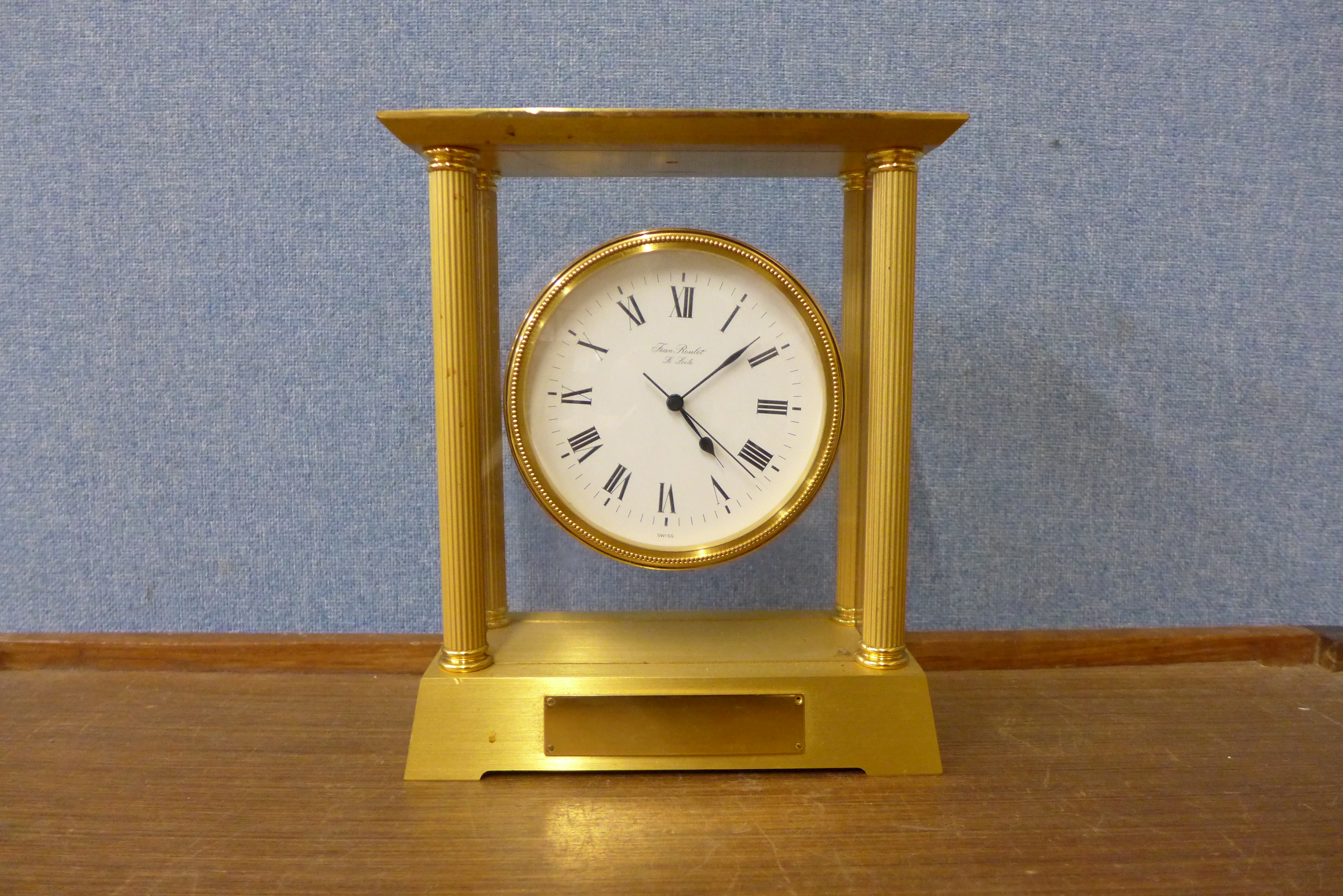 A Swiss brass mantel clock, the dial signed Fean Roulet, L.