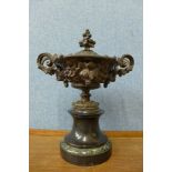 A continental metal two handled urn and cover