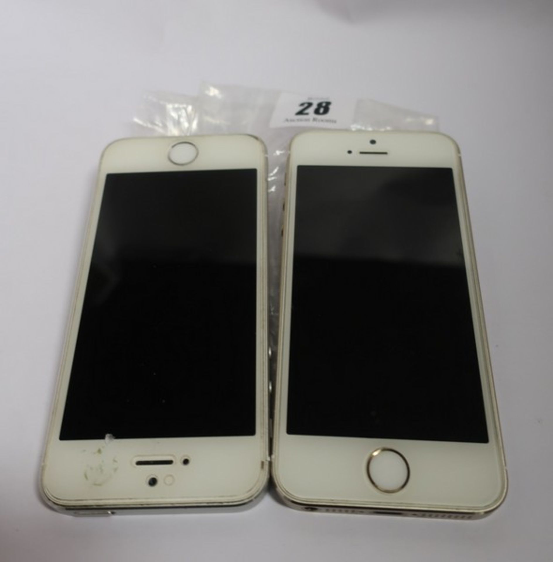 An Apple iPhone 5s A1533 64GB (IMEI: 013790007034557) and an Apple iPhone 5s A1457 16GB (IMEI: