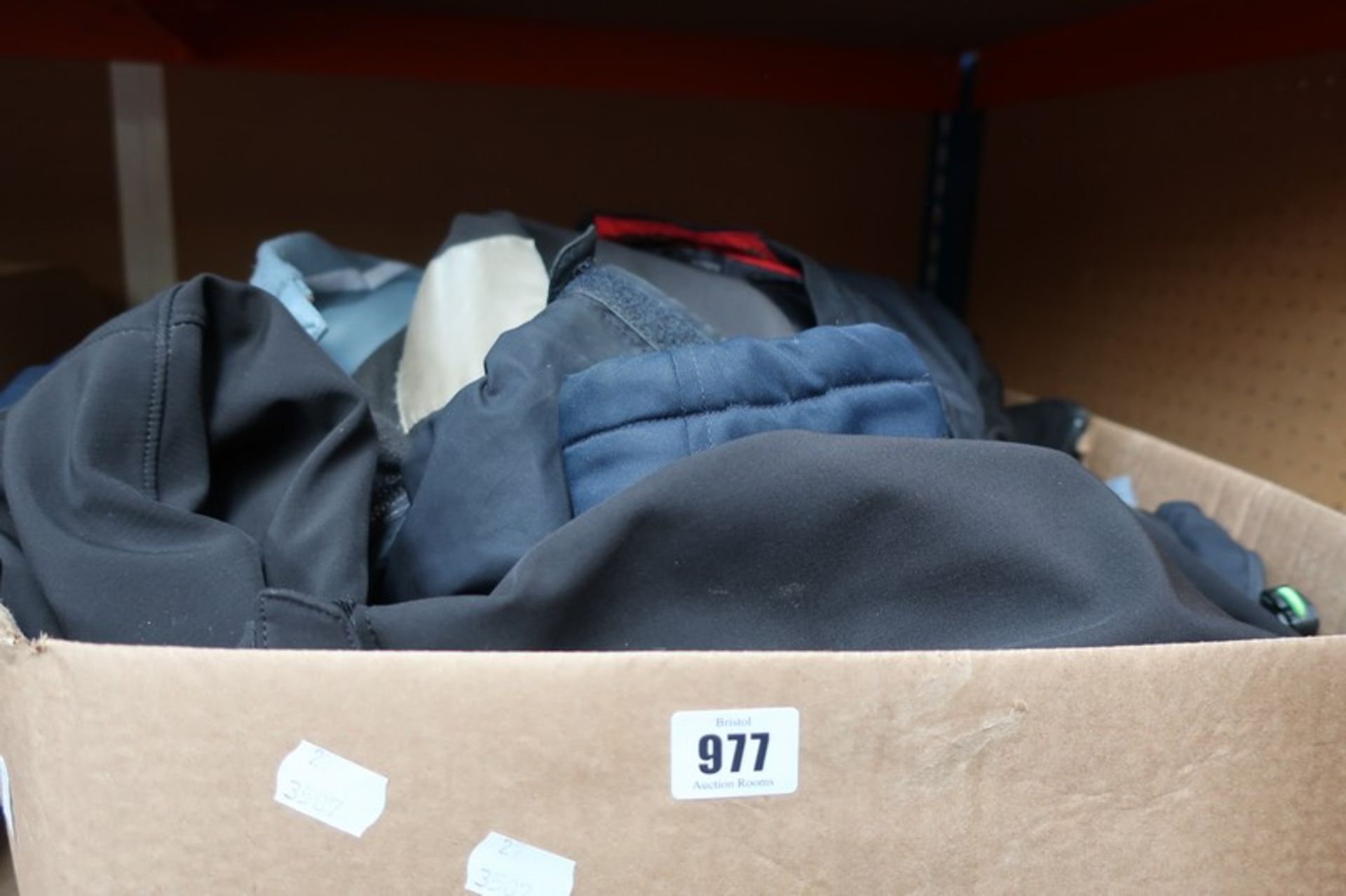 A box of pre-owned branded jackets/coats (9 items).