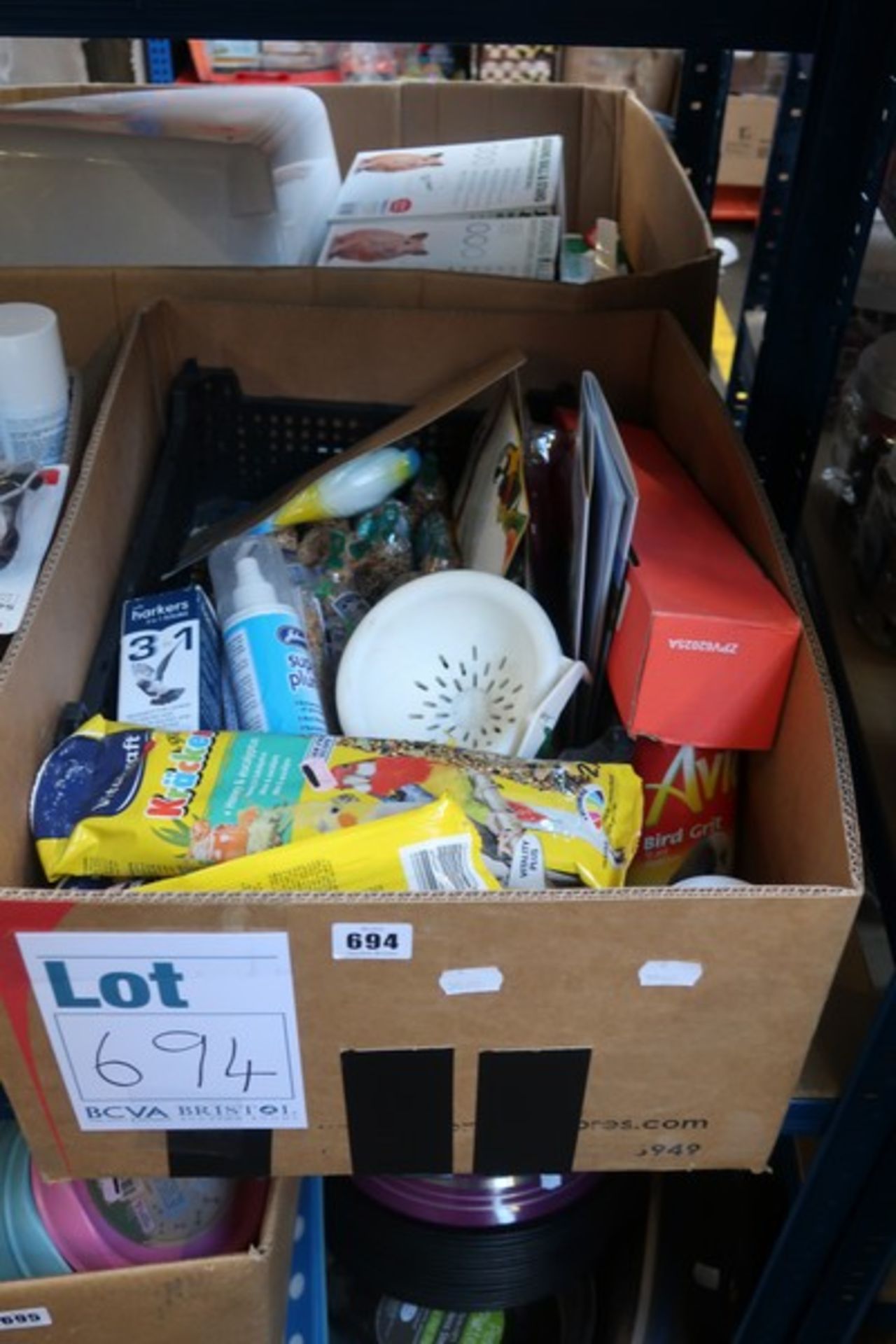 A box of bird accessories and treats.