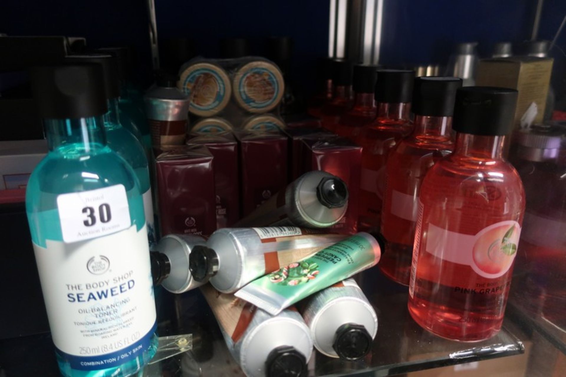 A quantity of as new Body Shop products to include shower gel, tonic and smoky rose eau de