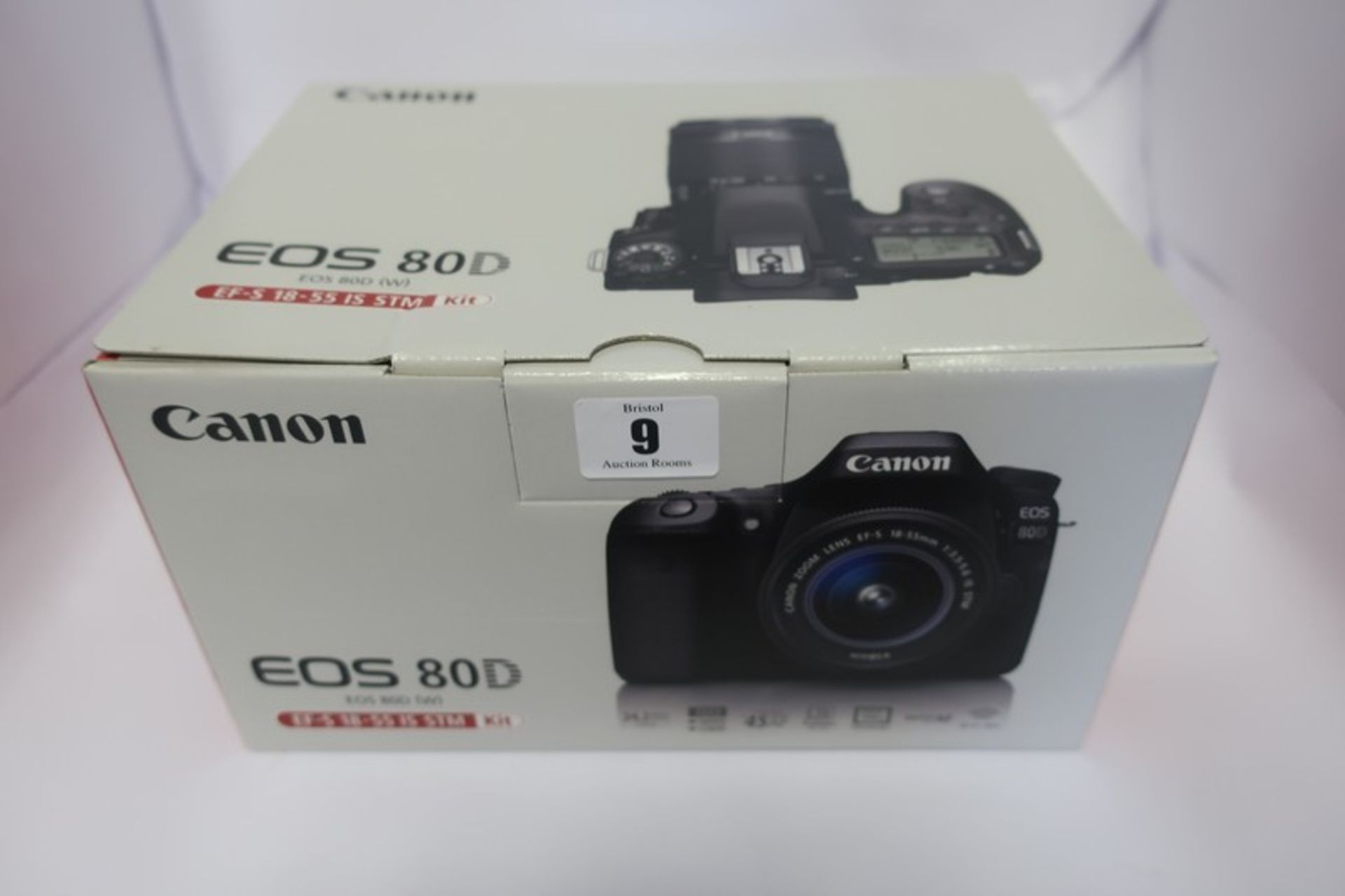 A boxed as new Canon EOS 80D (W) digital SLR camera with 18-55mm IS STM lens in black.