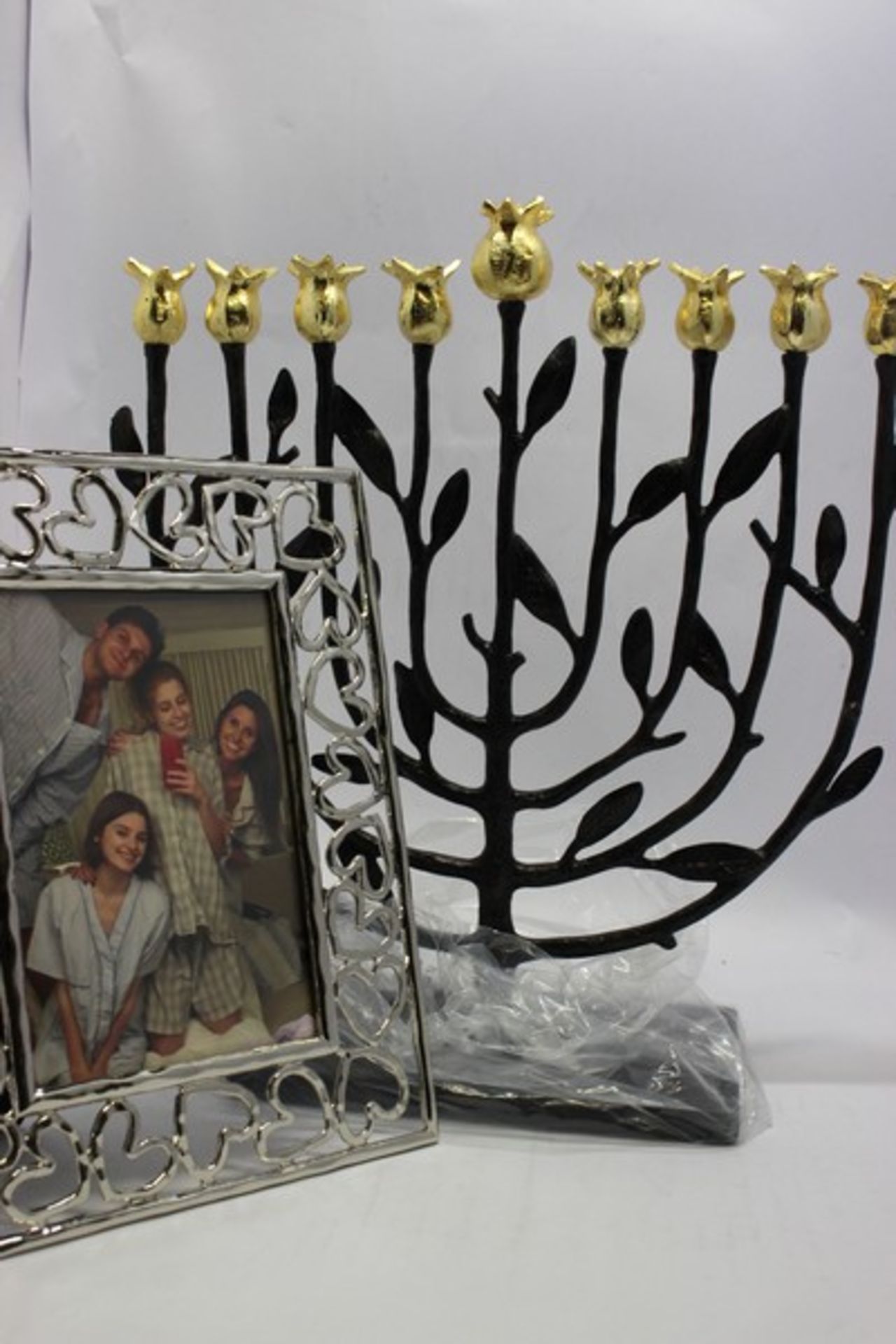 A boxed as new Michael Aram Pomegranate Kosher Menorah together with a boxed as new Michael Aram