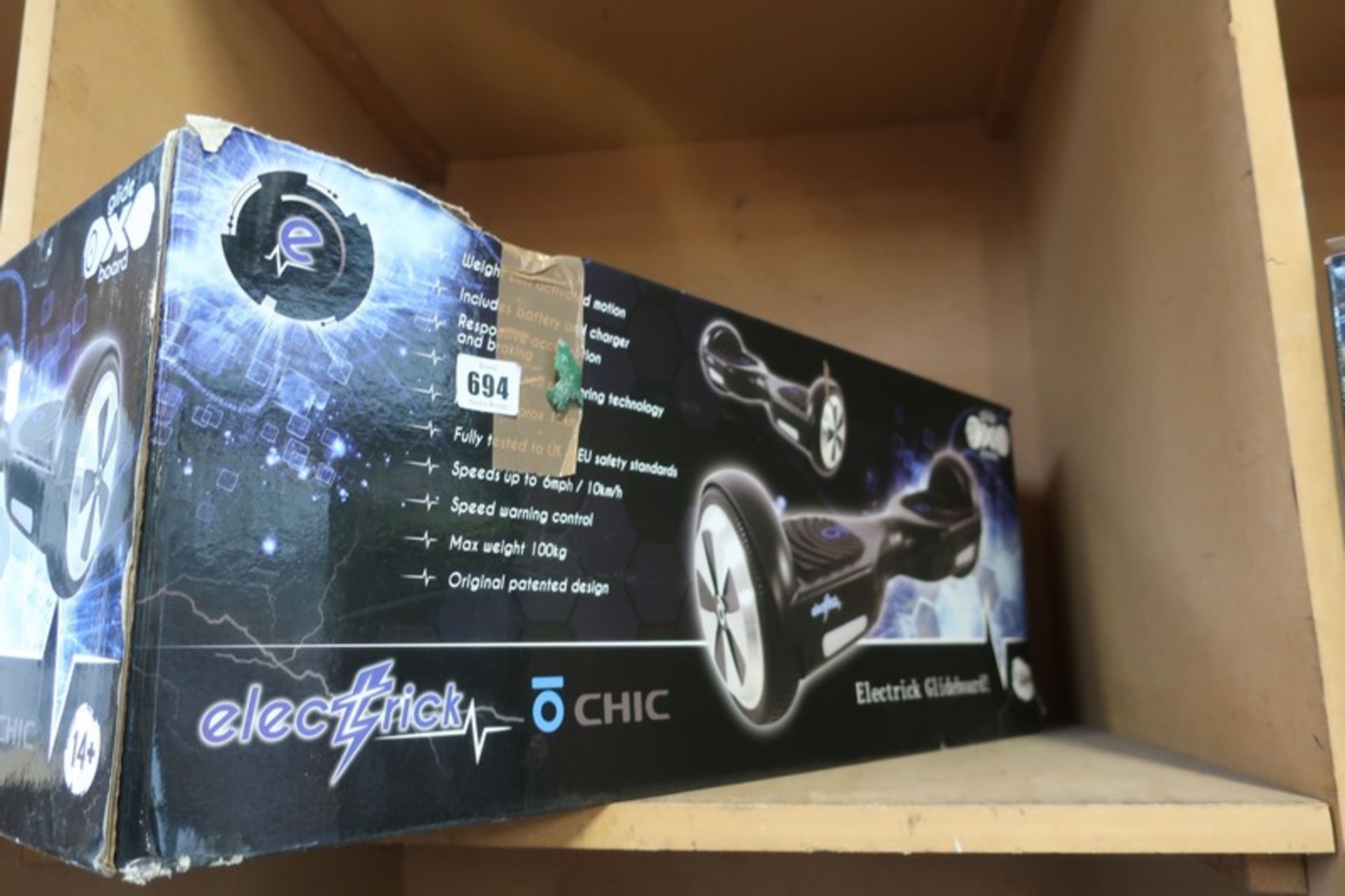 A boxed as new Elecstick hover board with charger.