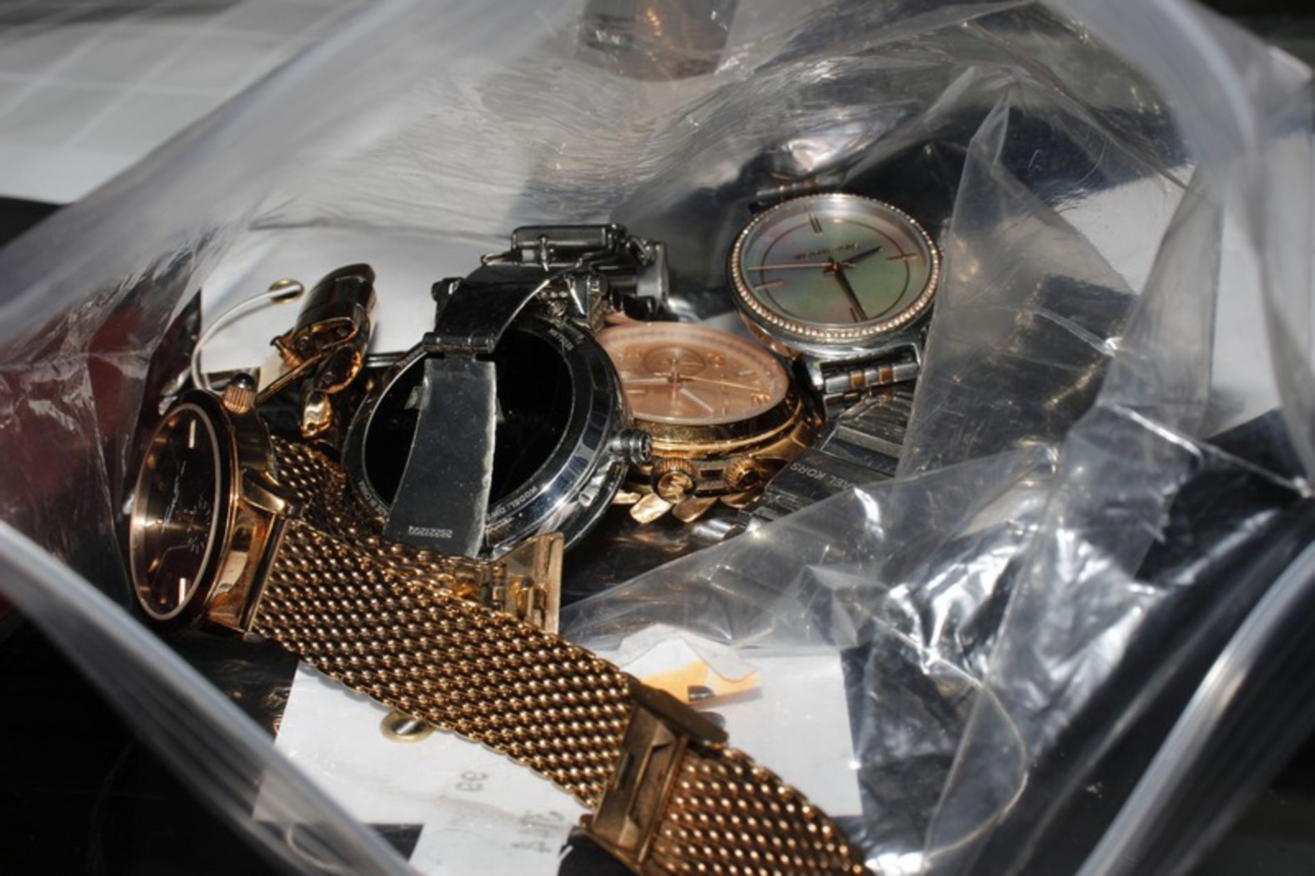 Five Michael Kors wrist watches and one Thomas Sabo wrist watch.