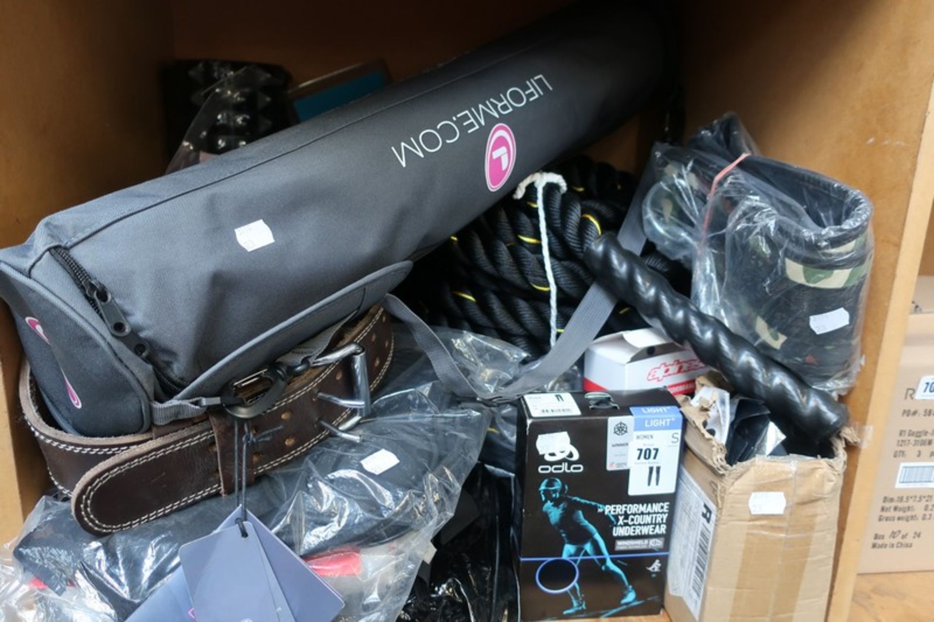 A quantity of finess related items to include a Liforme yoga mat, battle rope and a bodybolster.