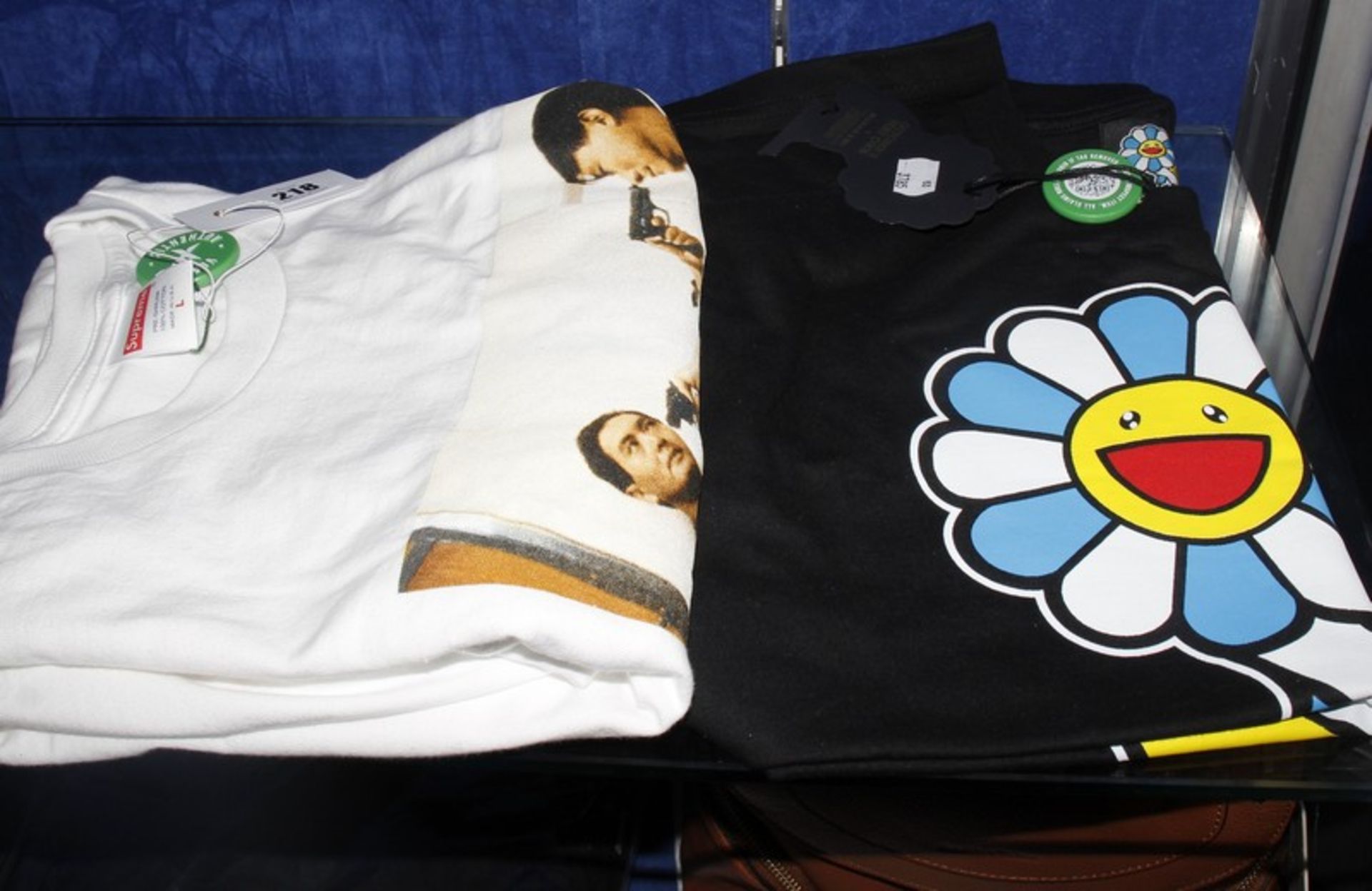 A Supreme The Killer T-shirt (L) and an October's Very Own X Murakami T-shirt (M) both from Stock