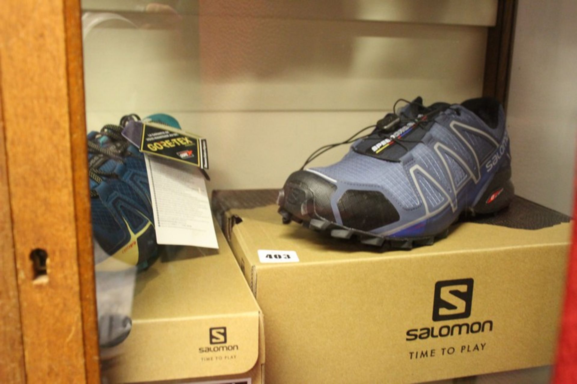 A pair of Salomon Speedcross 4 (UK 12) and a pair of Speedcross Vario 2 GTX (UK 6) (Both as new).