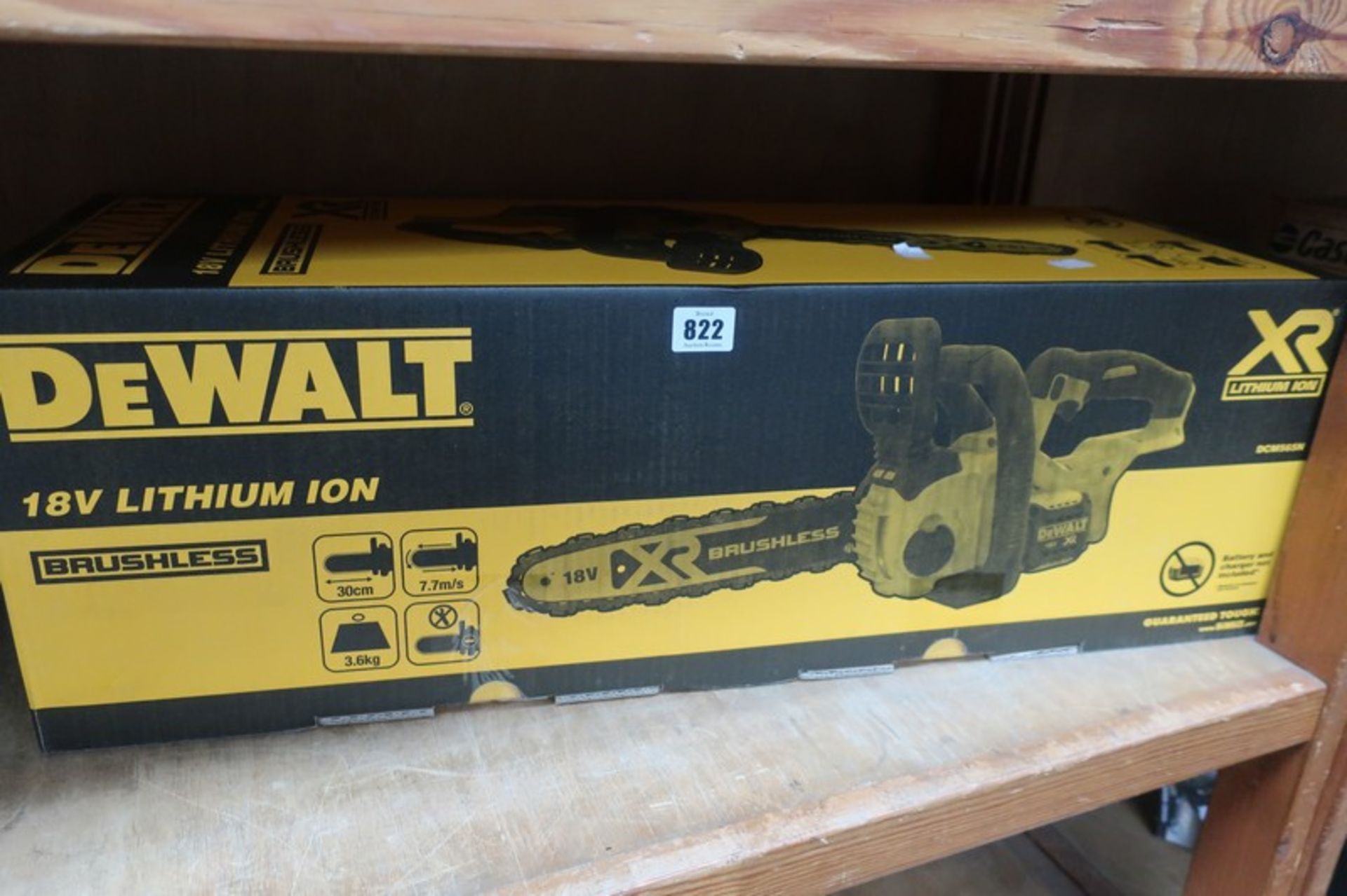 A boxed as new Dewalt cordless XR brushless chain saw 18v (DCM565N).