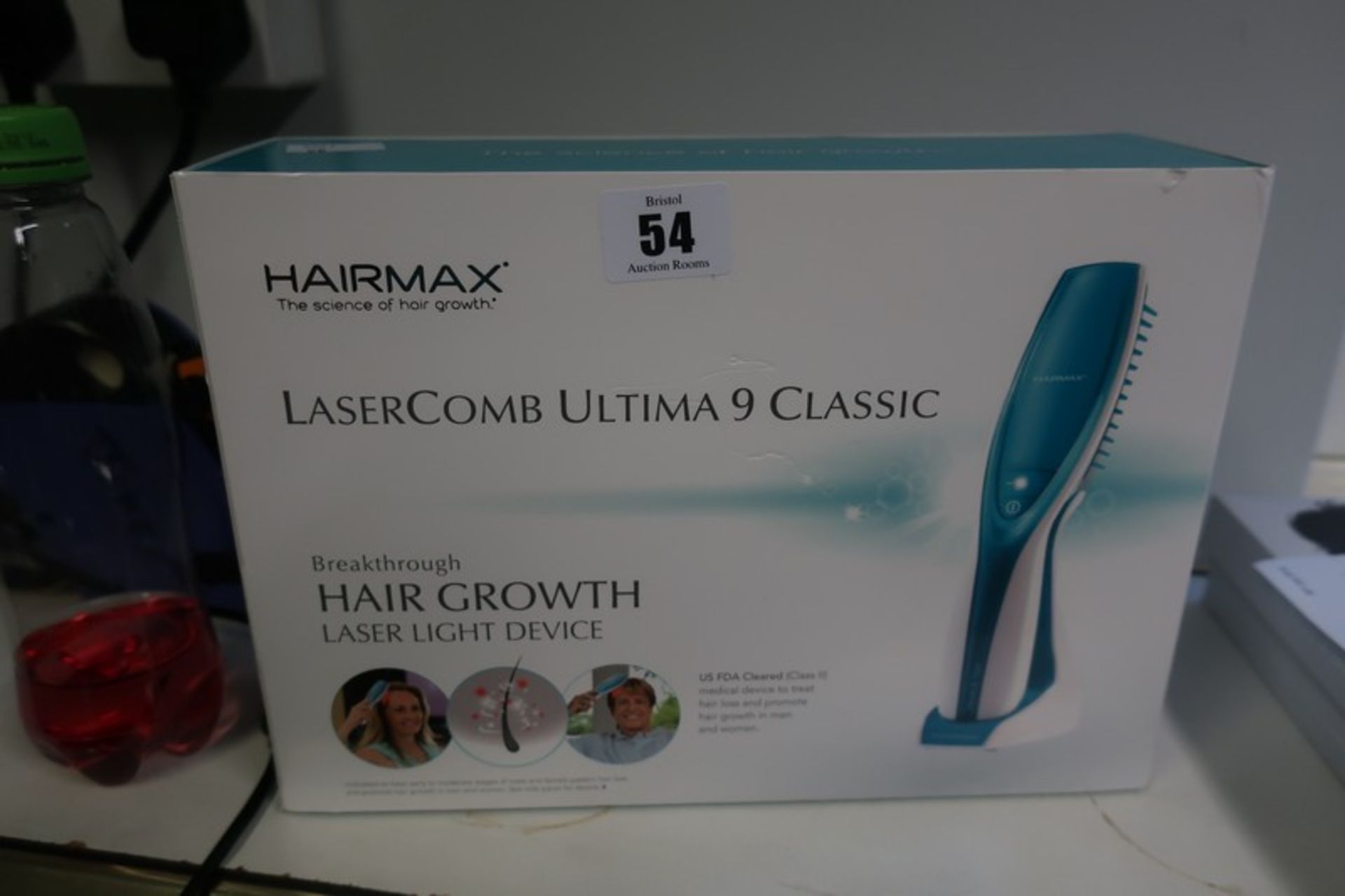 A boxed as new Hairmax laser comb Ultima 9 classic.