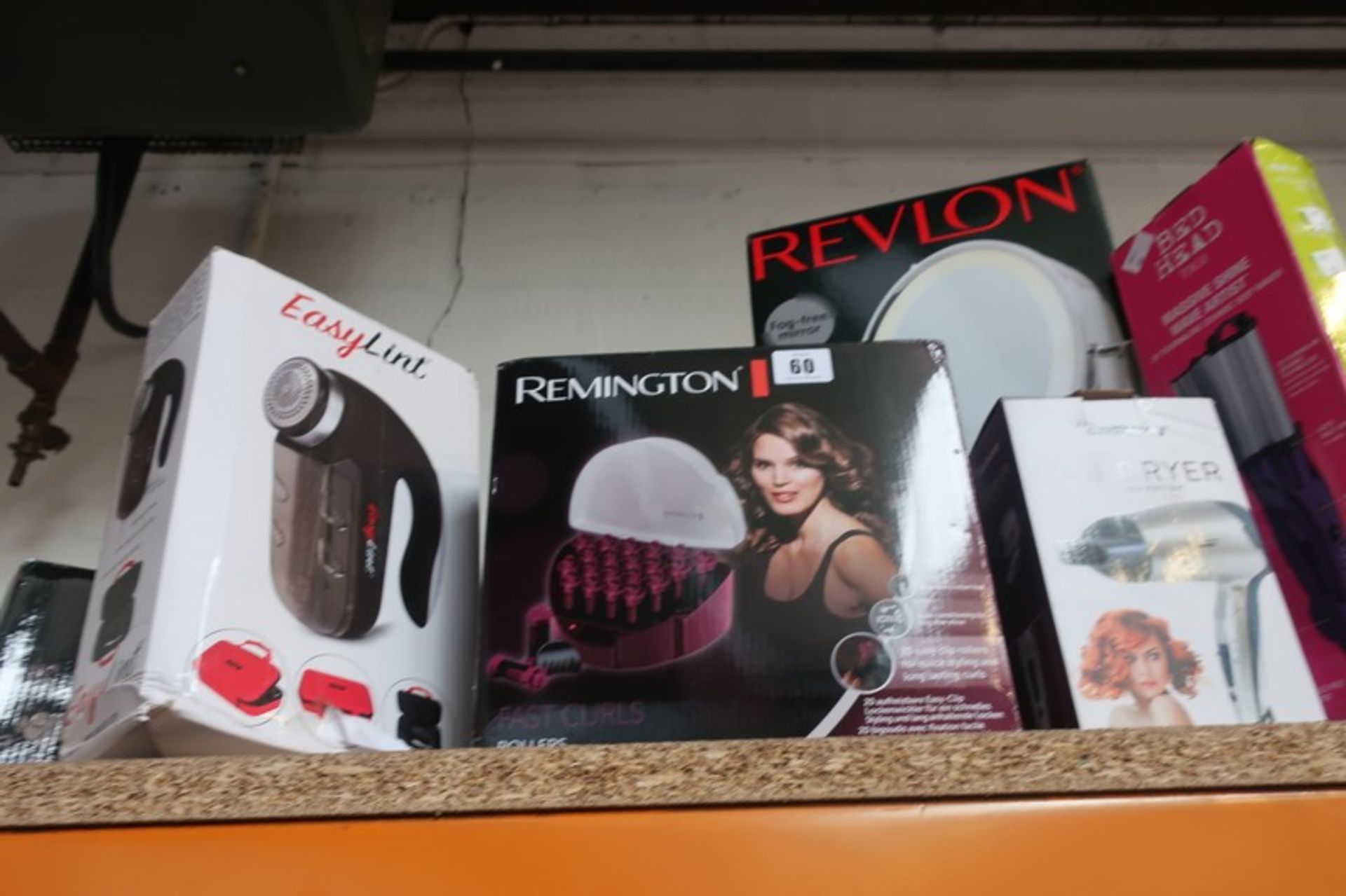 A boxed as new Revlon perfect touch lighted oval swivel mirror (1x or 7x magnification), Remington