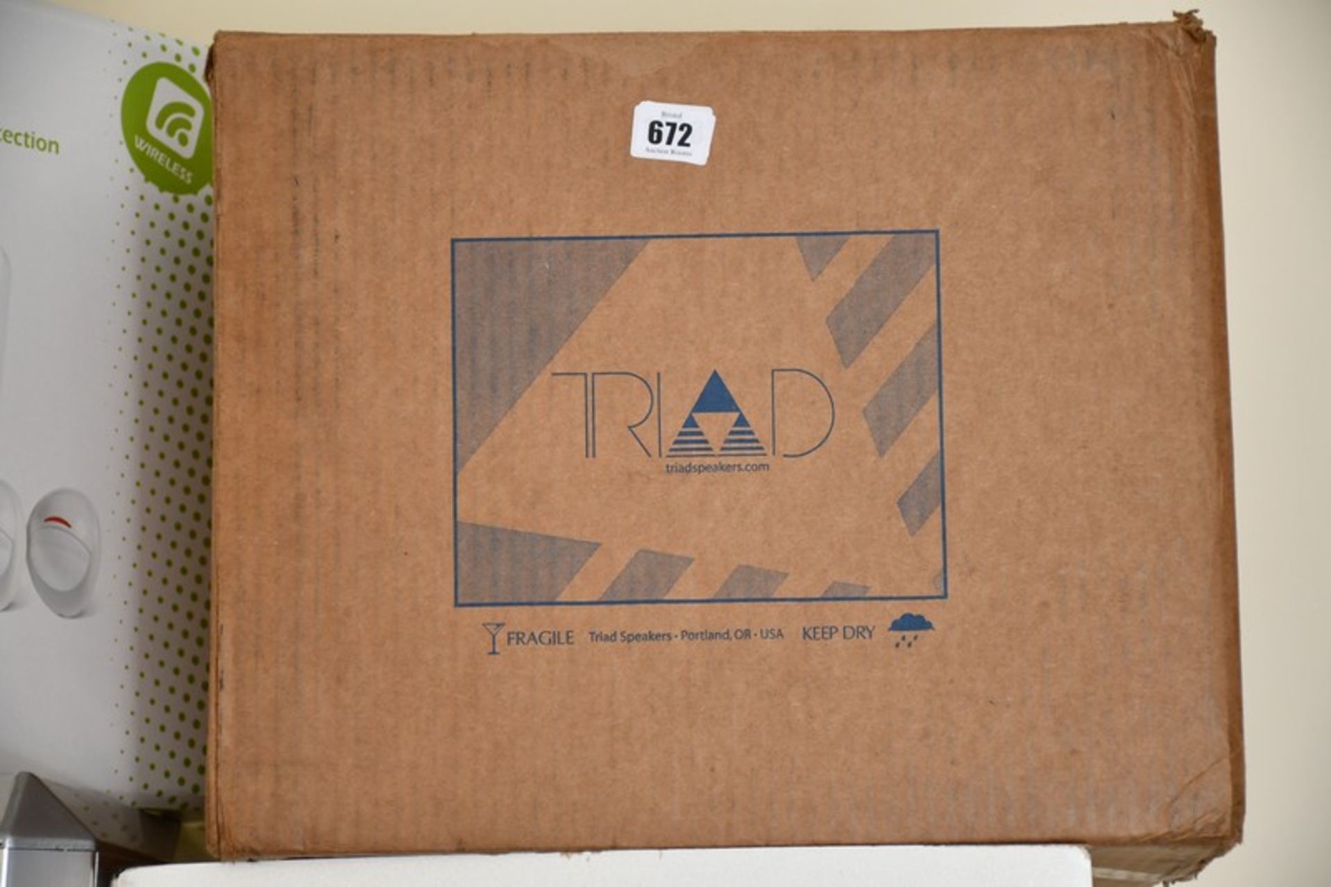 A boxed as new Triad In Wall Bronze Satellite Speaker (Model: 4403-1000-3).