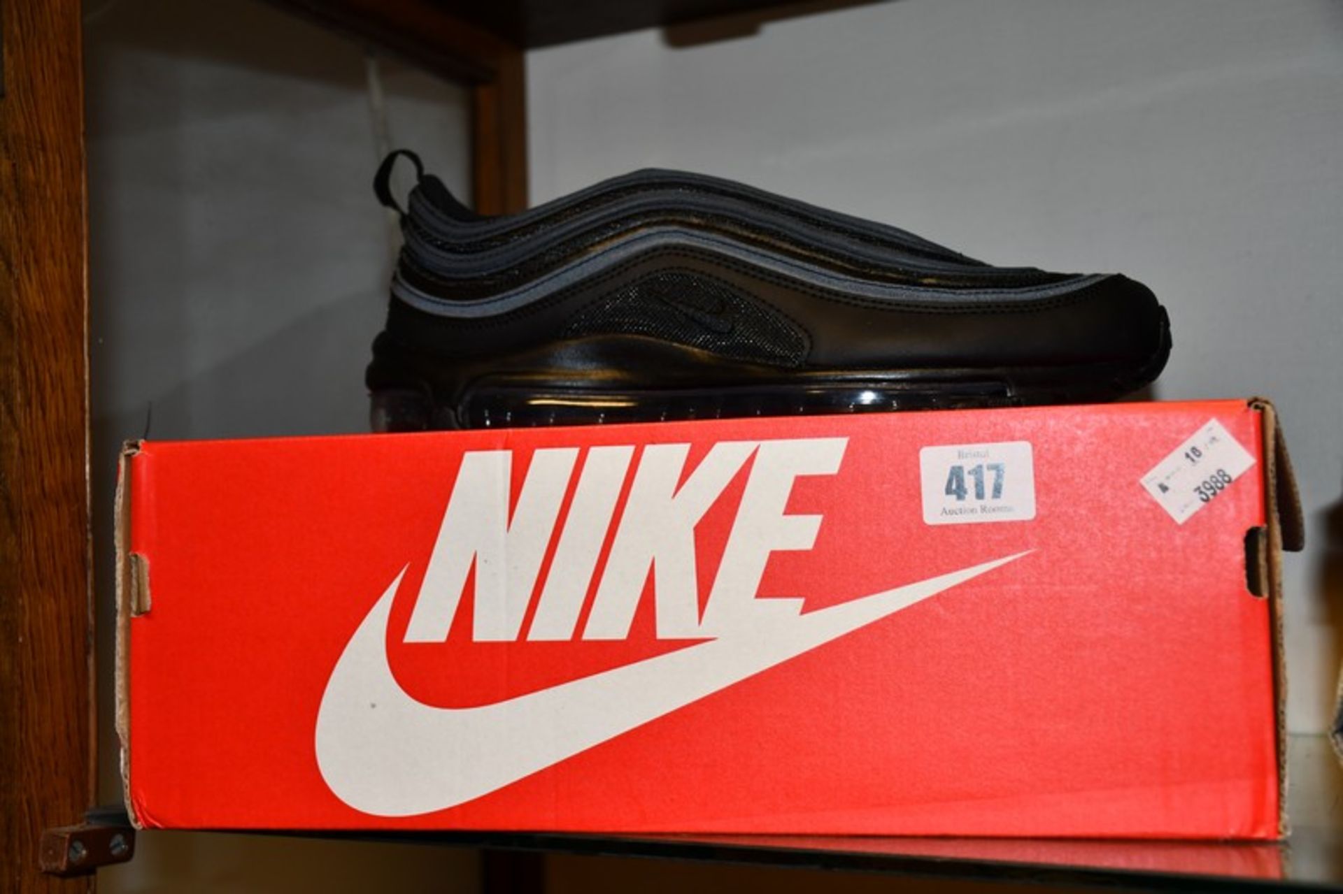 A pair of as new Nike Air Max 97 trainers in black (UK 6).