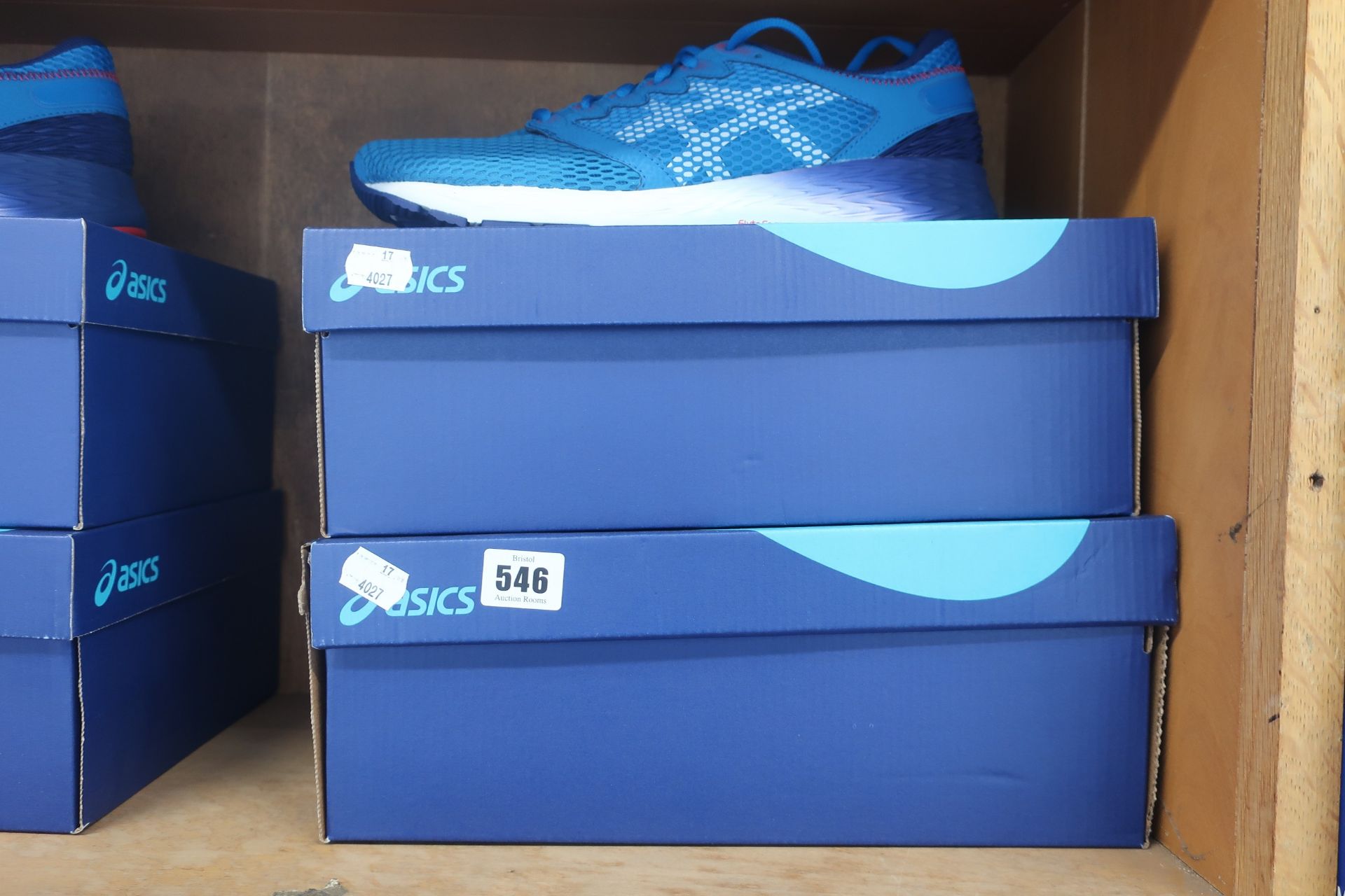 Two pairs of as new Asics Roadhawk FF2 trainers in race blue/white (UK 9 and 9.5).