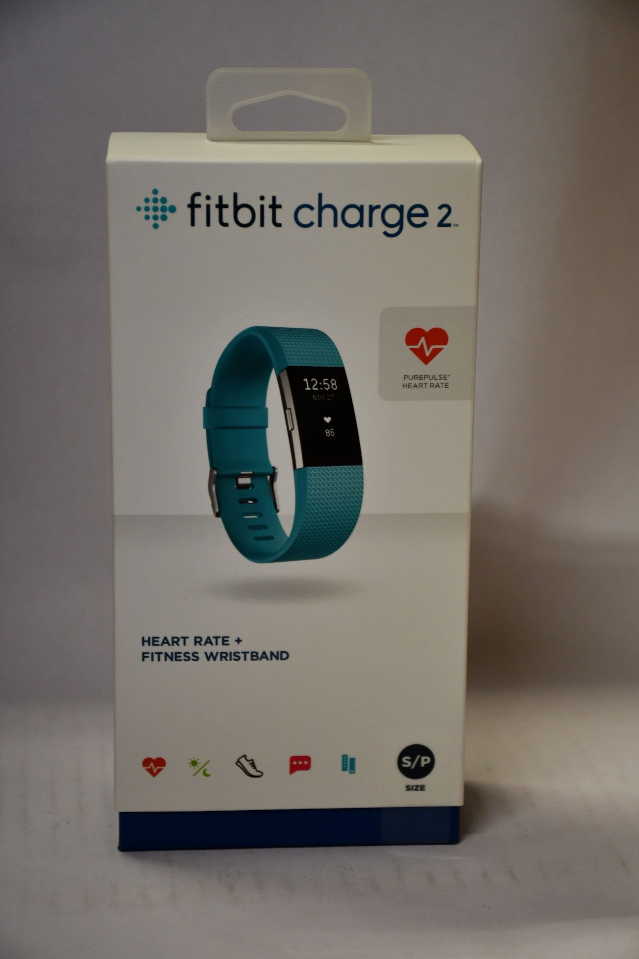 A boxed a new Fitbit Charge 2 heart rate and fitness band (Stainless steel/teal).