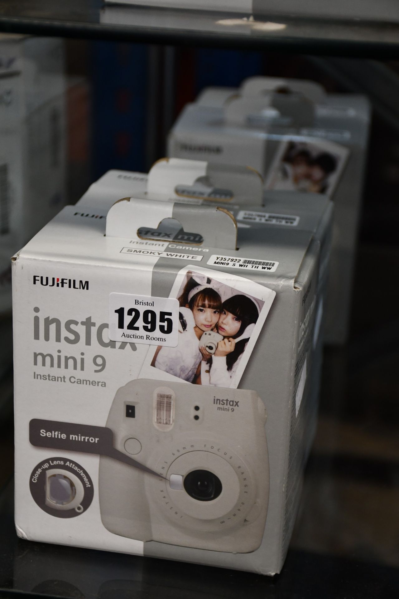 Two boxed as new Fujifilm instax mini 9 instant cameras in smoky white.