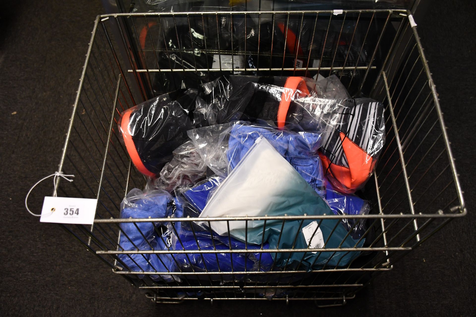 A quantity of as new sportswear to include Nike, Under Armour and a Glide Soul wetsuit (Basket not