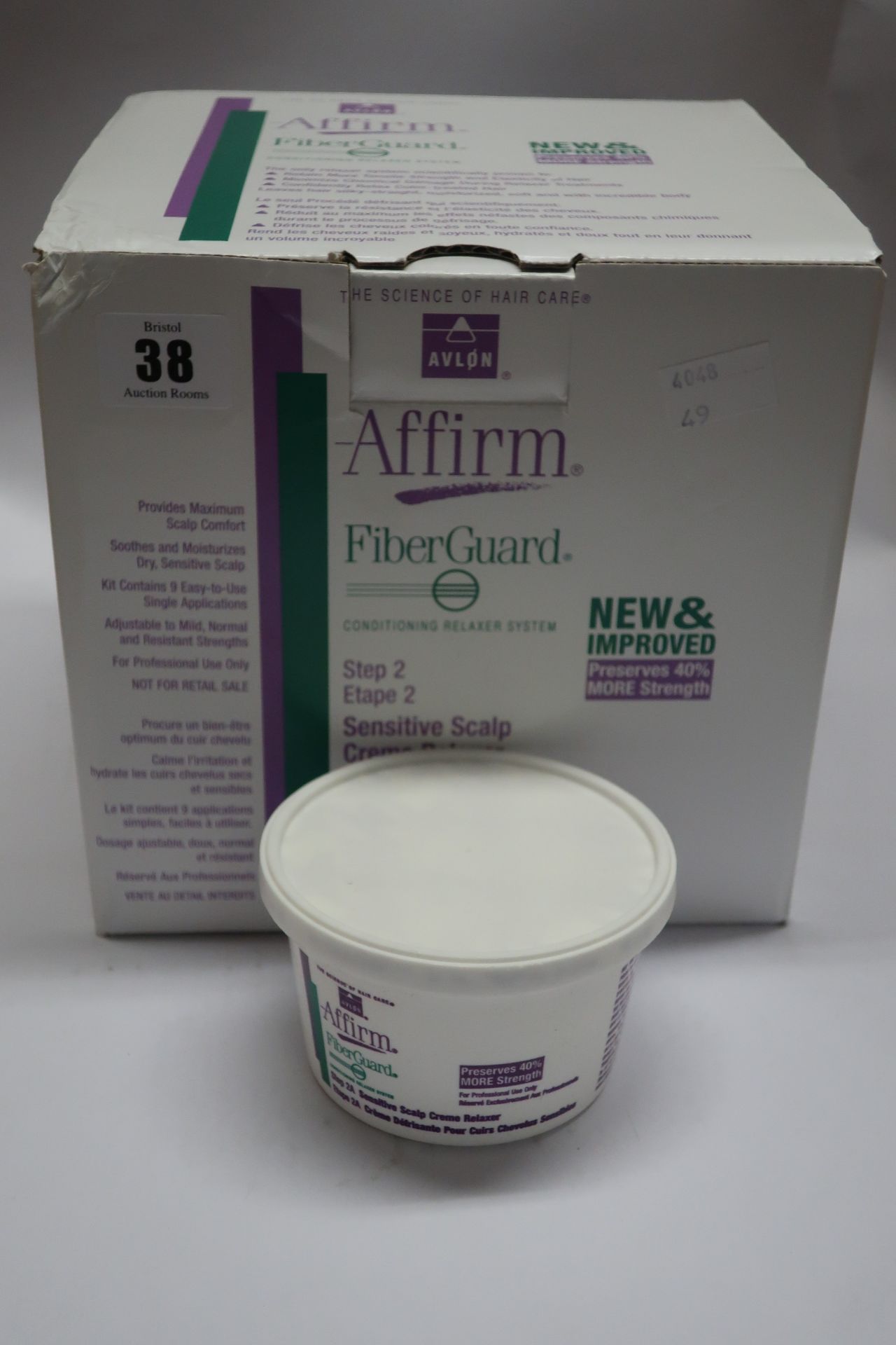 Two boxed as new Avlon Affirm Fiberguard conditioning relaxer systems.