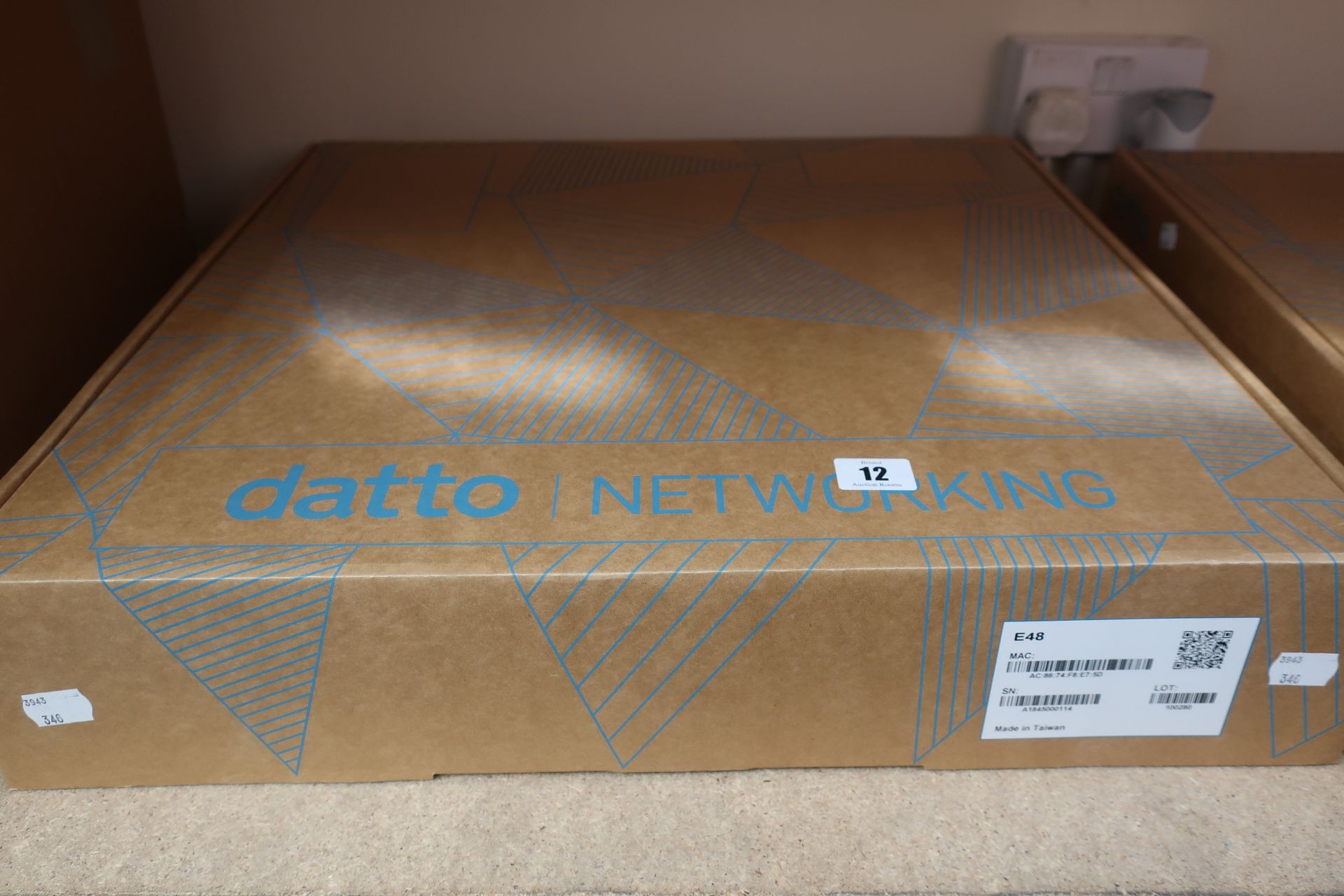 A boxed as new Datto Networking E48 48 Port Switch (Serial: A1845000114).