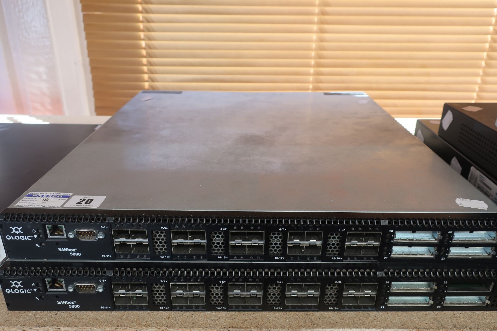 A pre-owned Qlogic SANBox 5802 24 Port 8G Fibre Channel SAN Switch (Model: SB5802V-08A A) (Part