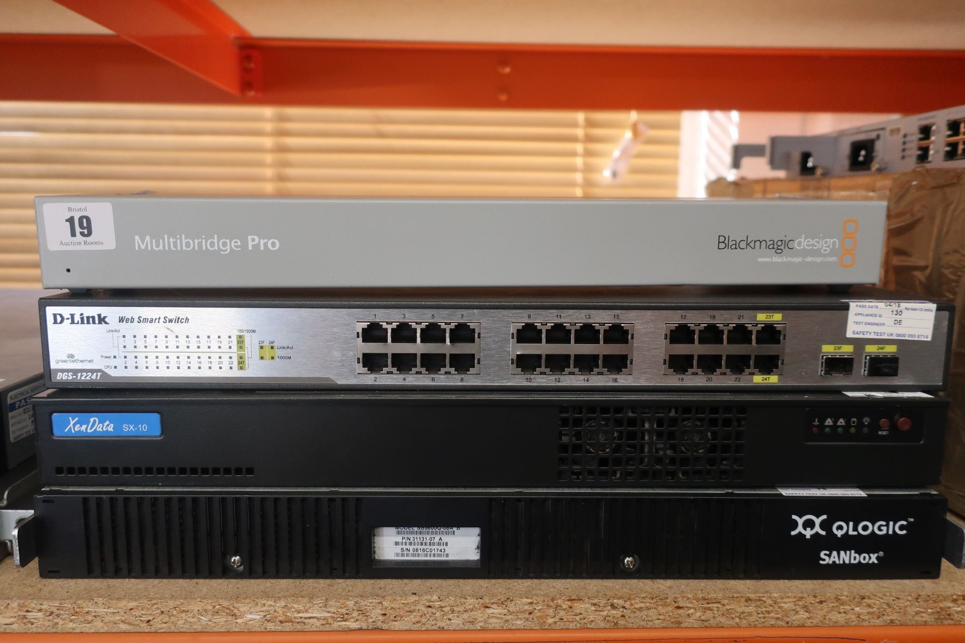 A pre-owned Q-Logic SANbox 5600 8-Port Gigabit Fibre Channel Switch (Model: SB5600Q-08A B), a pre-