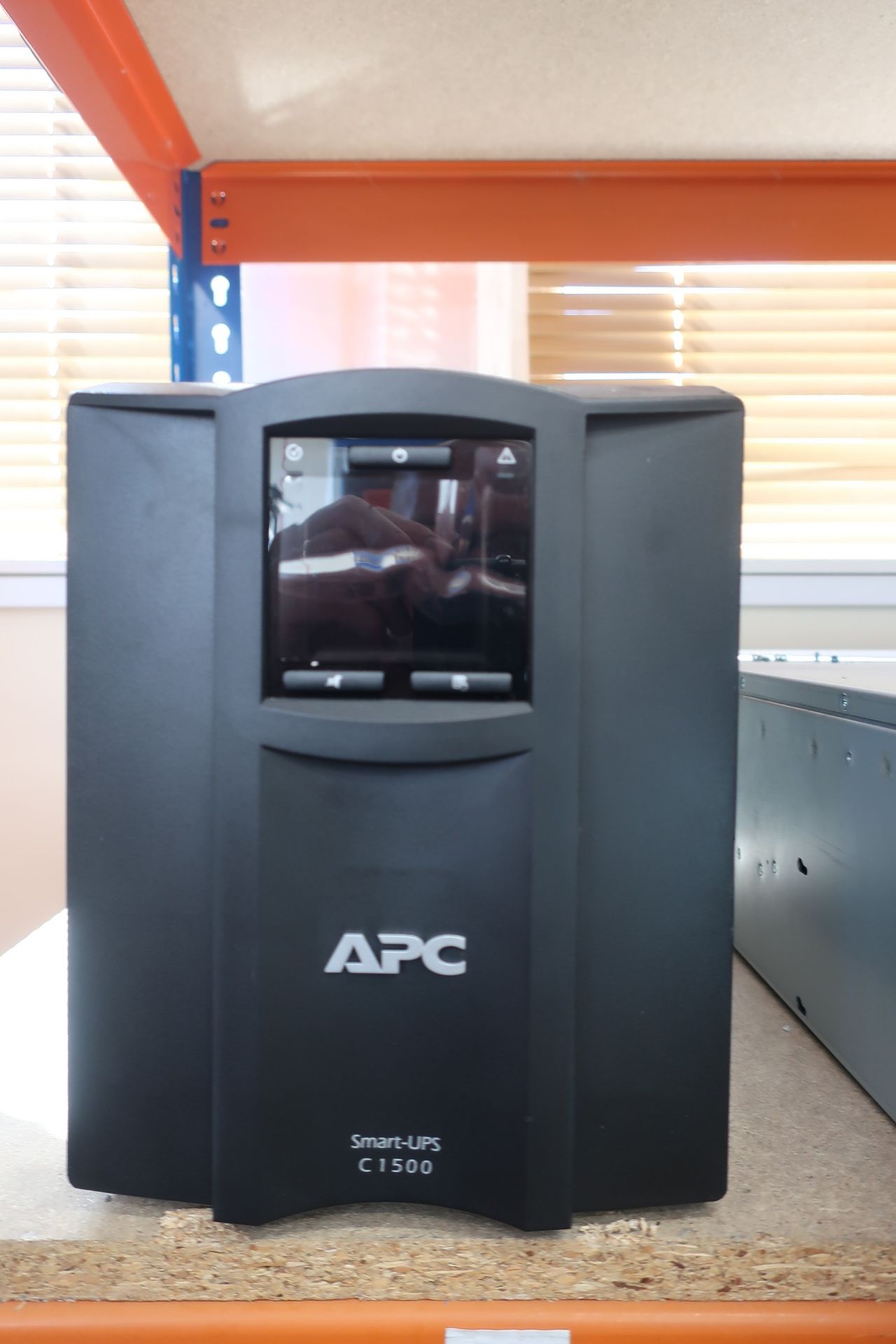 A pre-owned APC C 1500 1500VA 900W Smart-UPS (Output: 220v-240v 50/60Hz) (Model: SMC1500I) (