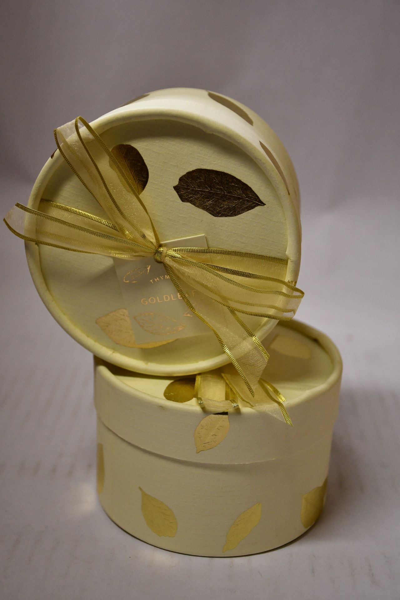 Four Thymes Goldleaf perfumed dusting powder.