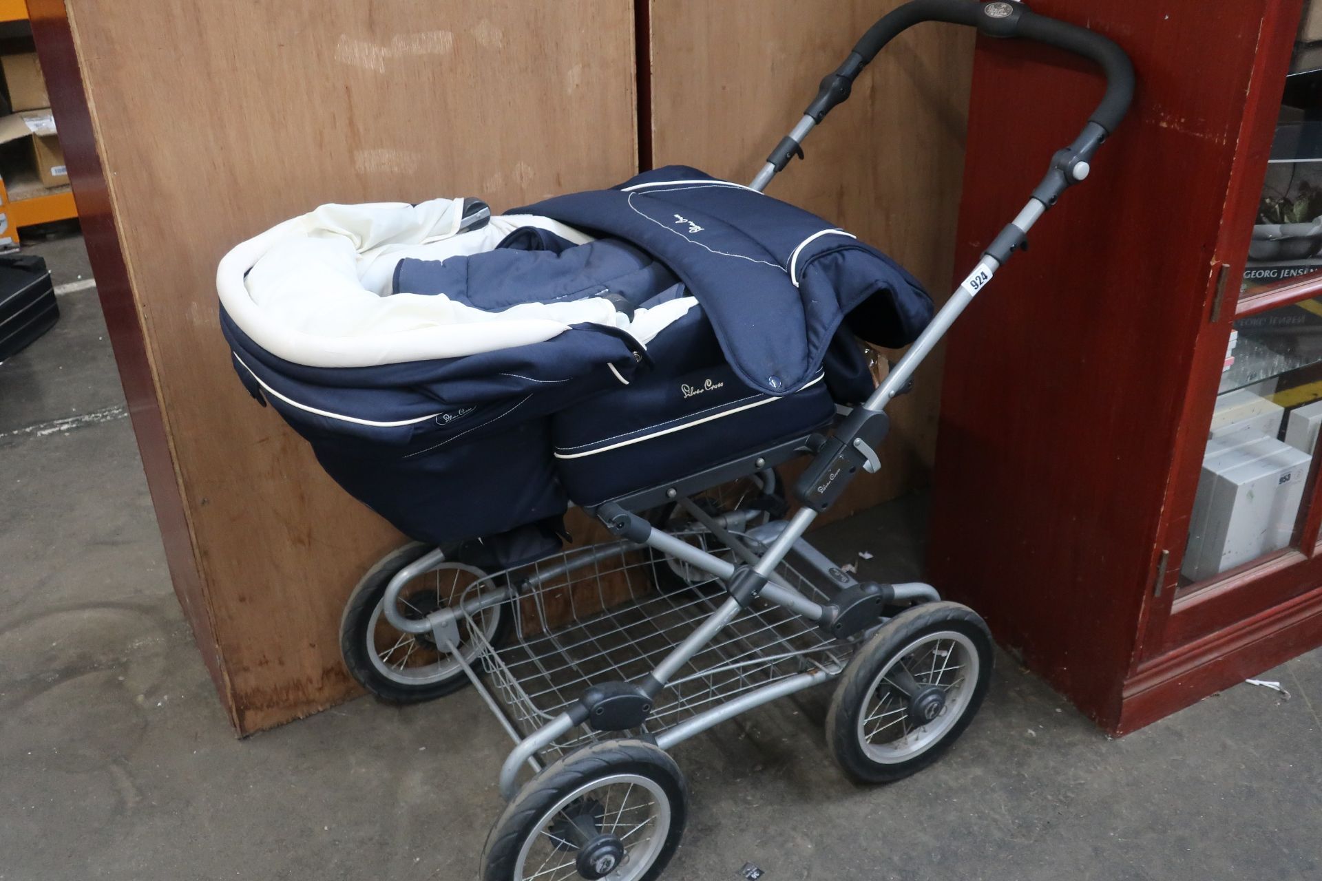 A pre-owned Silver Cross pram, navy and cream.