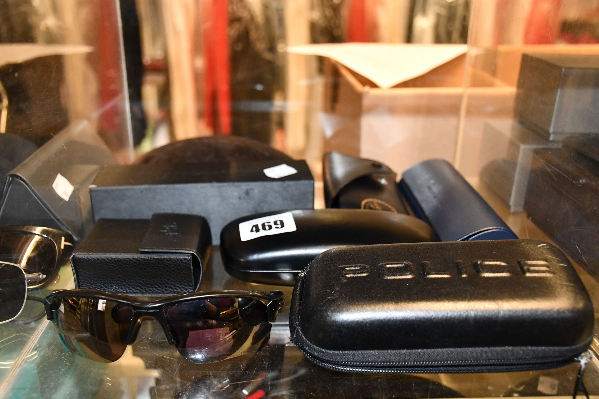 Eight pairs of branded sunglasses.