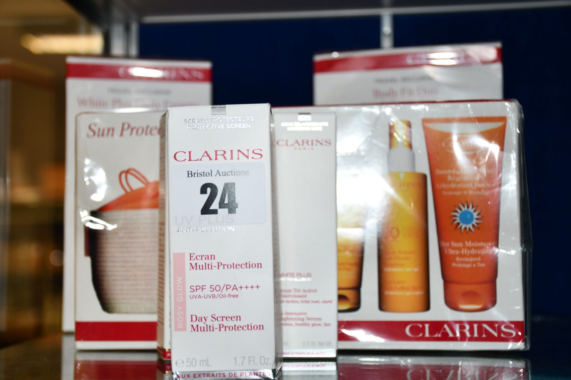 As new Clarins products; a White Plus Daily Experts set, Sun Protection Essential set, Body Fit