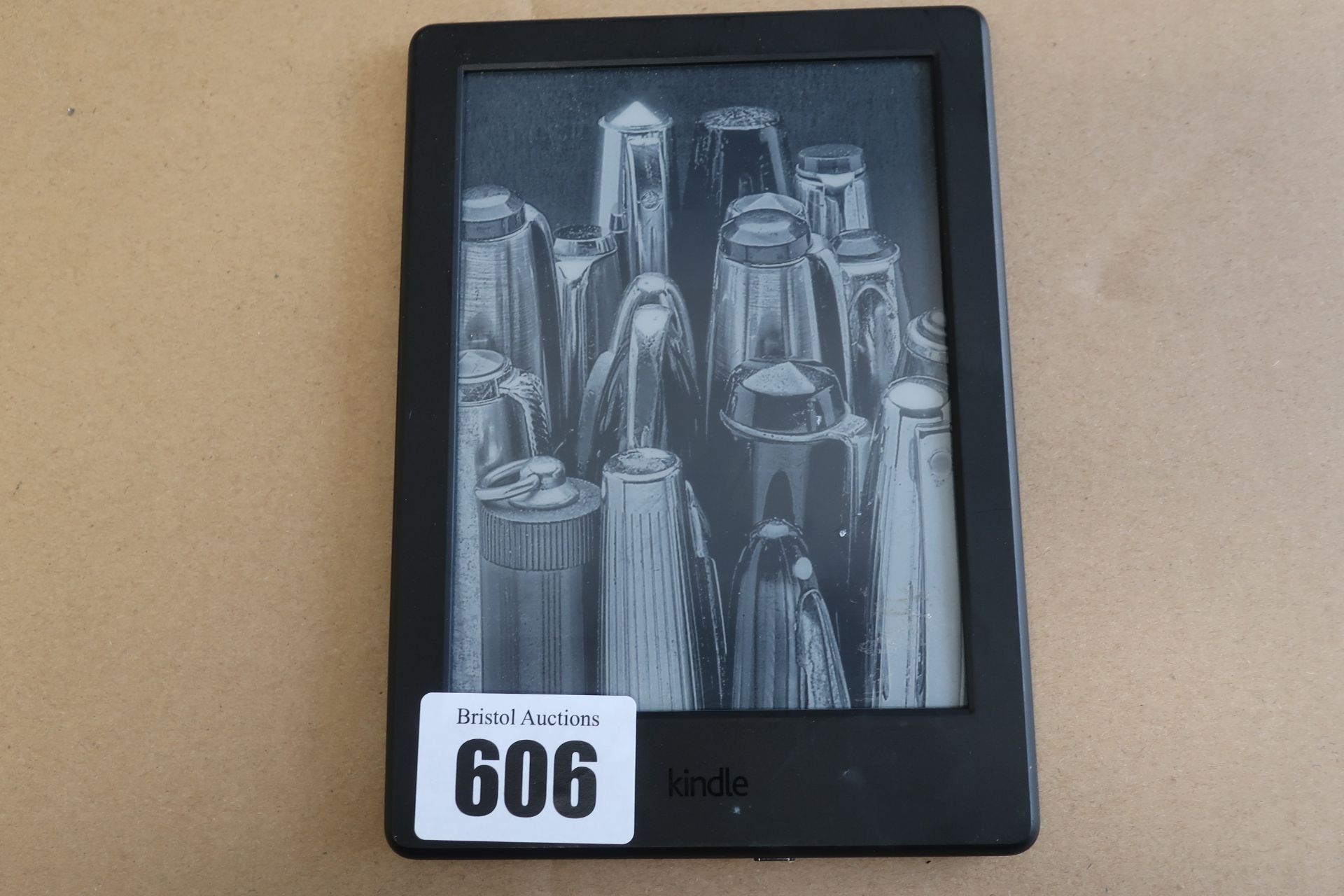A pre-owned Amazon Kindle (SY69JL) E-Reader in Black.
