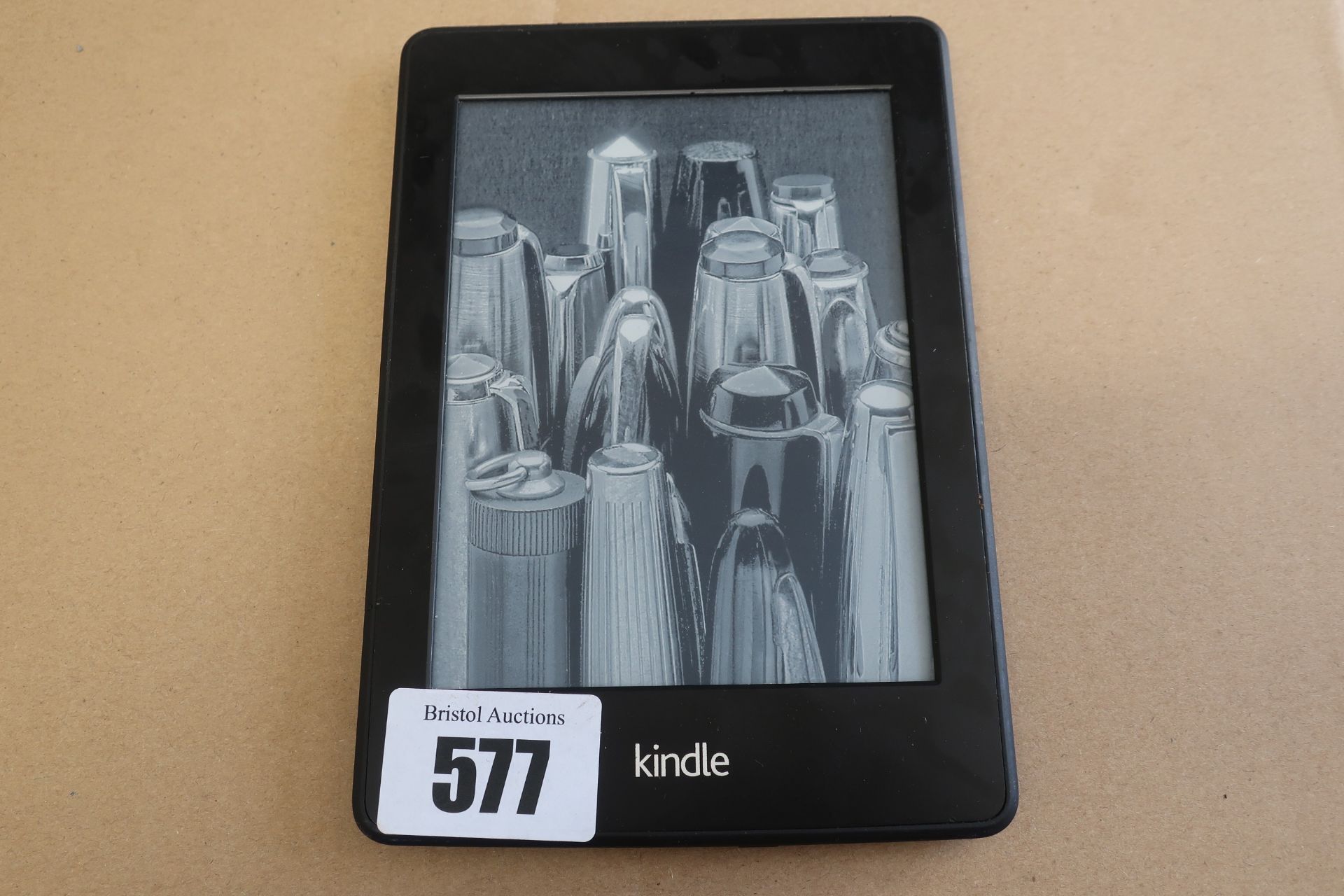 A pre-owned Amazon Kindle Paperwhite (DP75SDI) 6” E-Reader in Black.