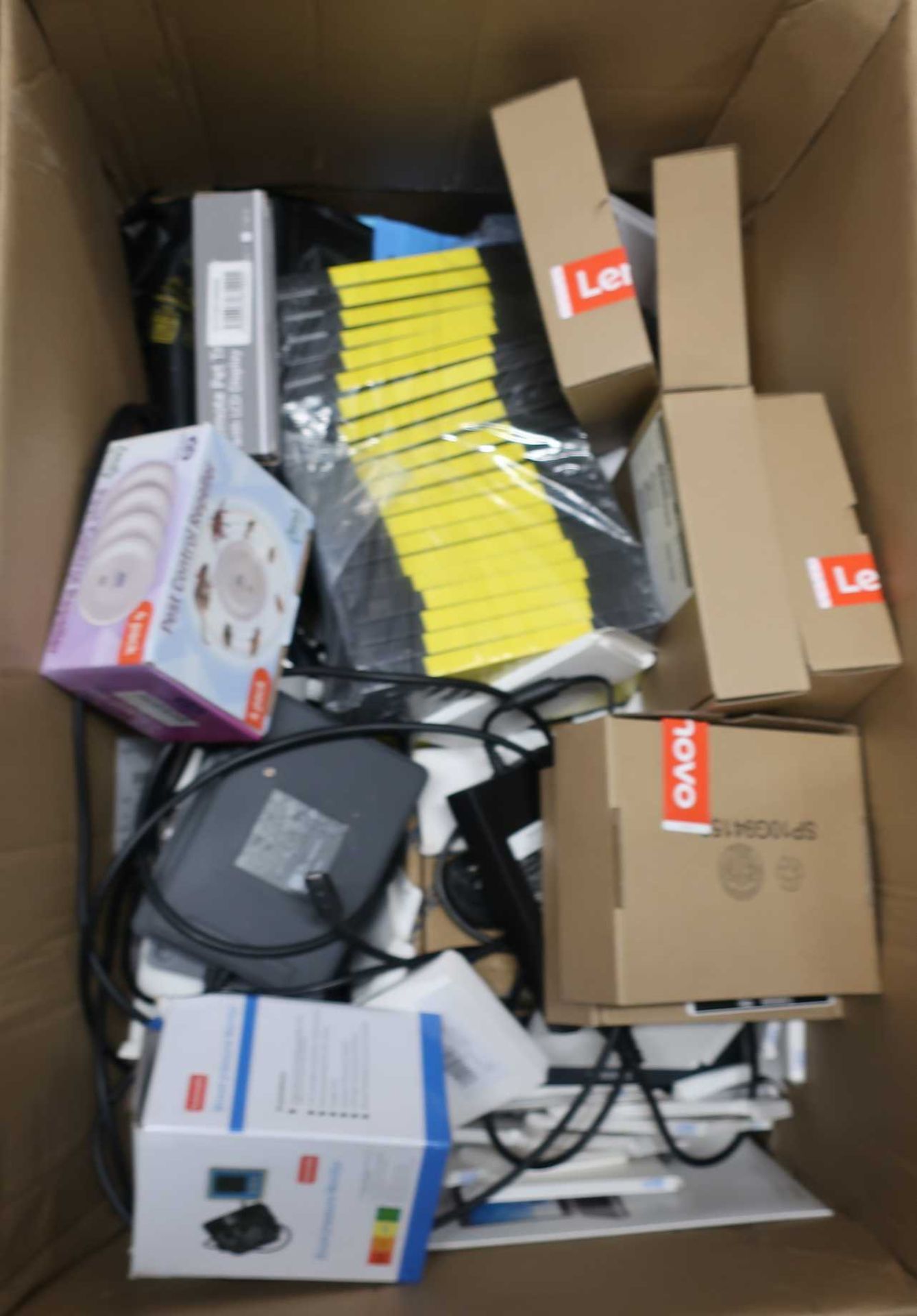 A box of assorted new and pre-owned electronic and computing items and accessories.