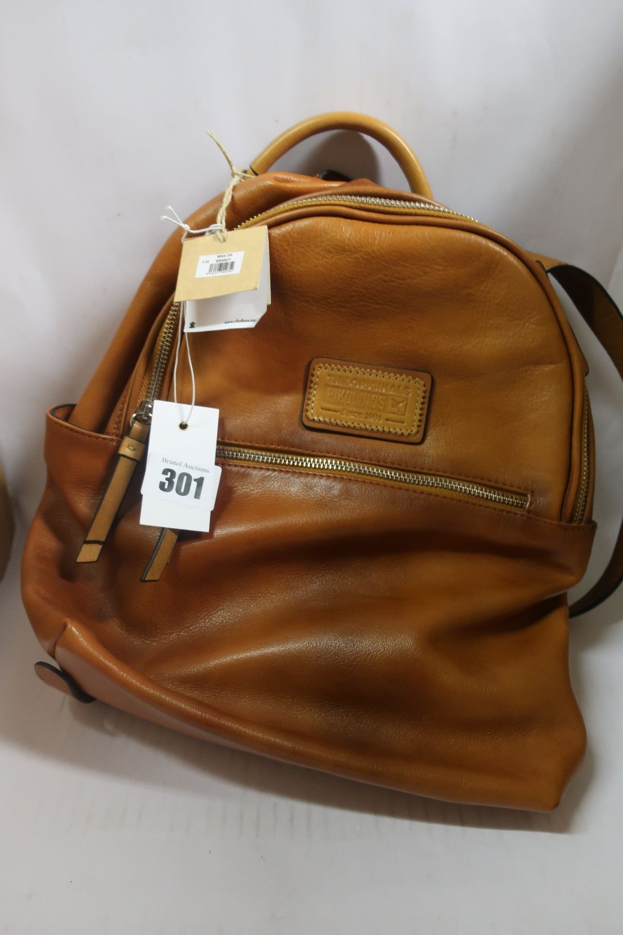 An as new Pikolinos WHA leather backpack in brandy (RRP €150) with dust bag.