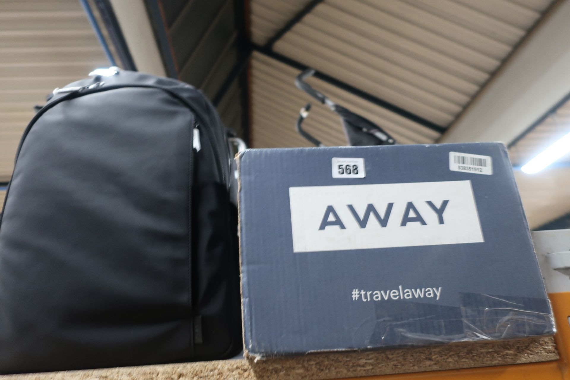 A boxed as new Away rucksack in black.