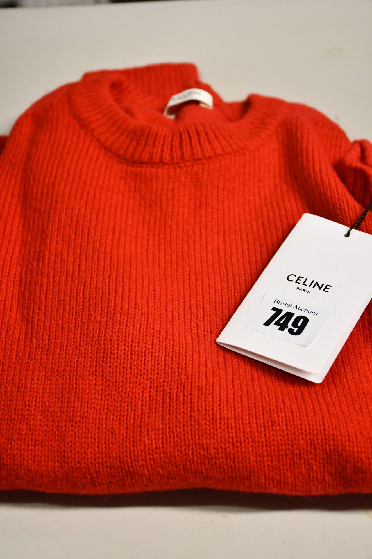 An as new Celine Knitwear red jumper with label.