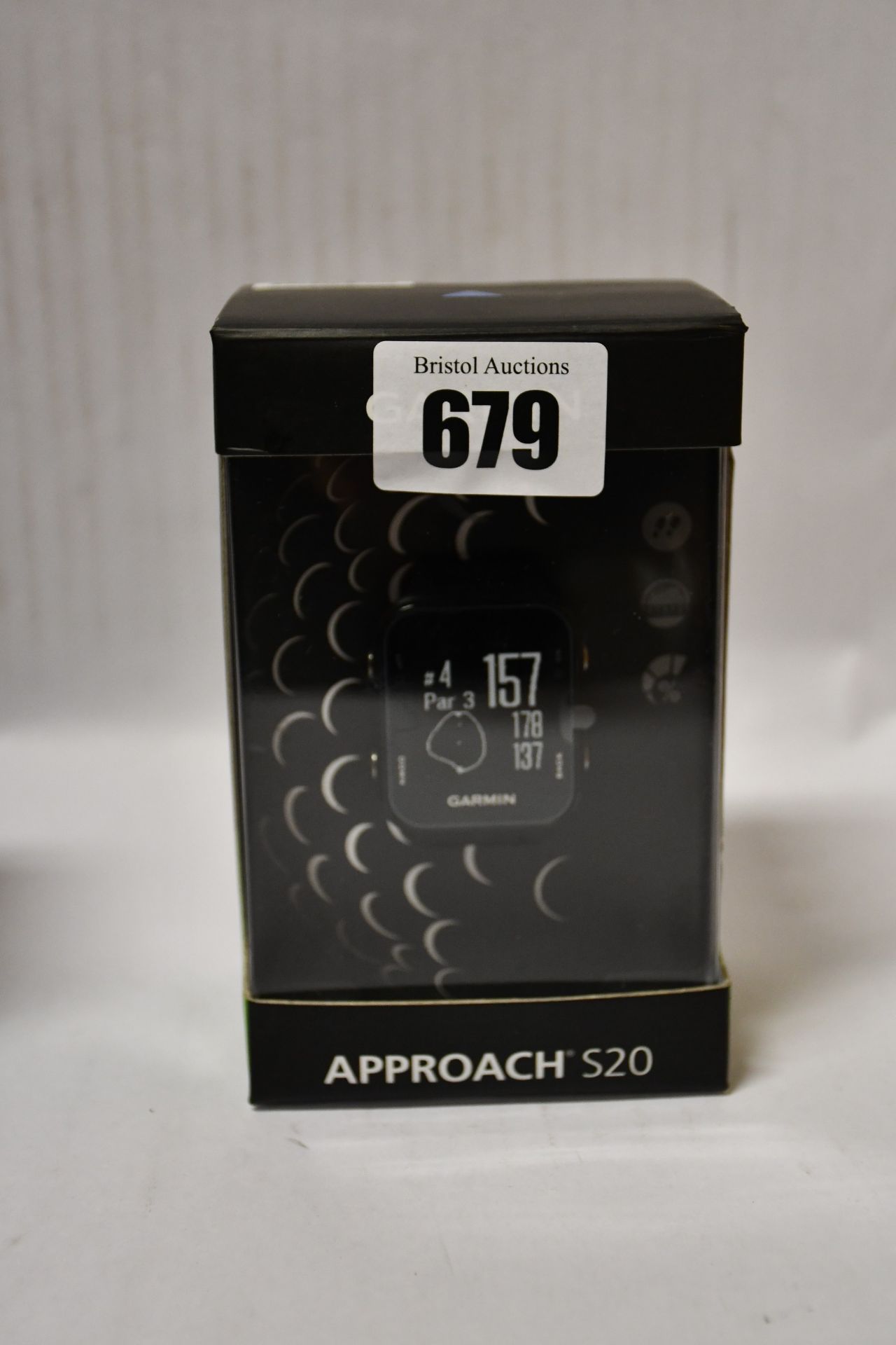 One man's boxed as new Garmin Approach S20 GPS golf watch with step tracking in black.