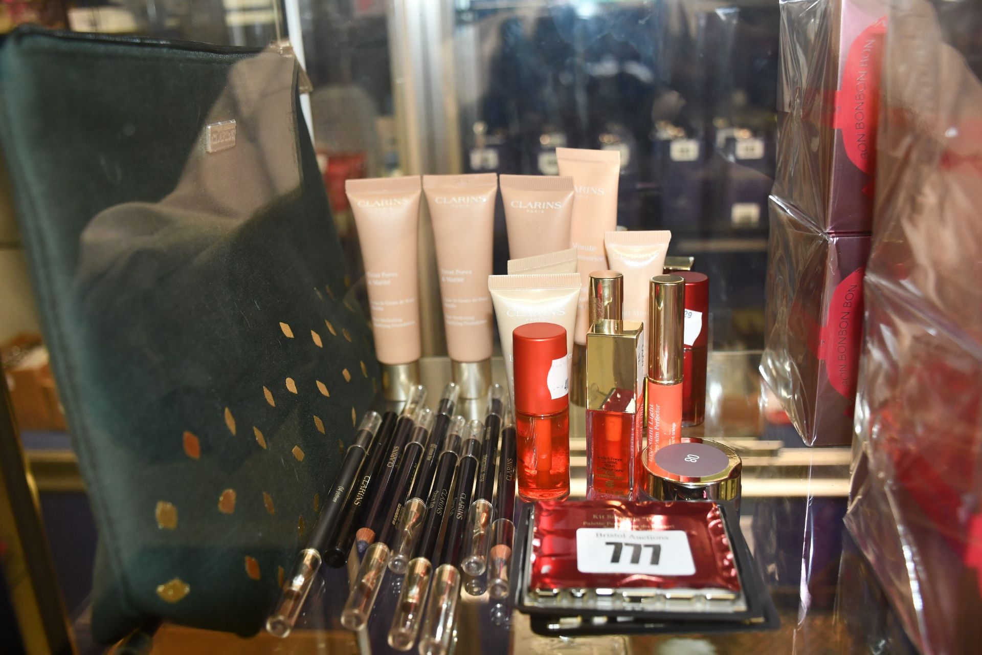 Nineteen items of assorted Clarins cosmetics to include water lip stain, eye and brow palette,