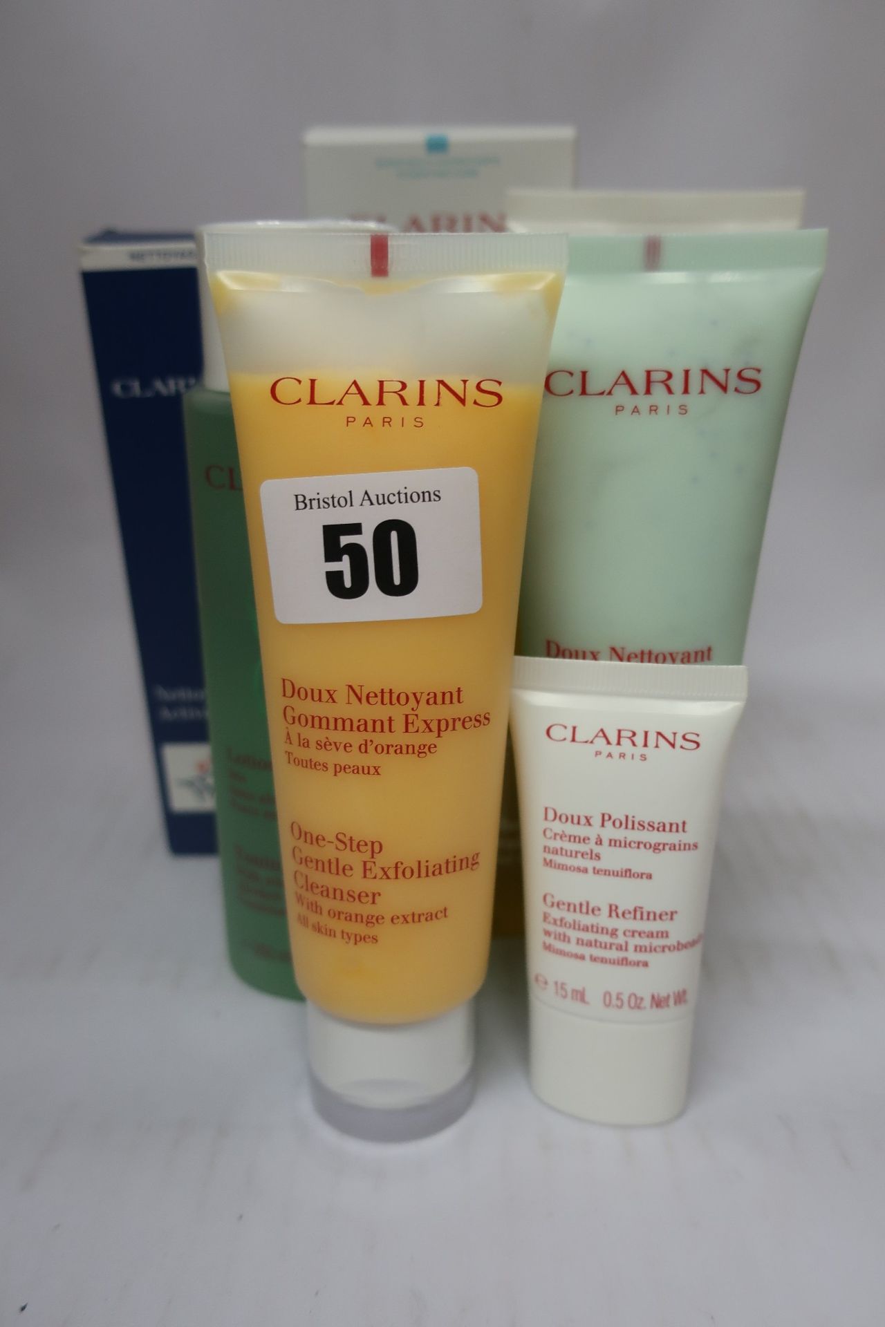 An as new Clarins Men Active face wash (125ml), two Clarins Moisture-Rich body lotion (200ml), a