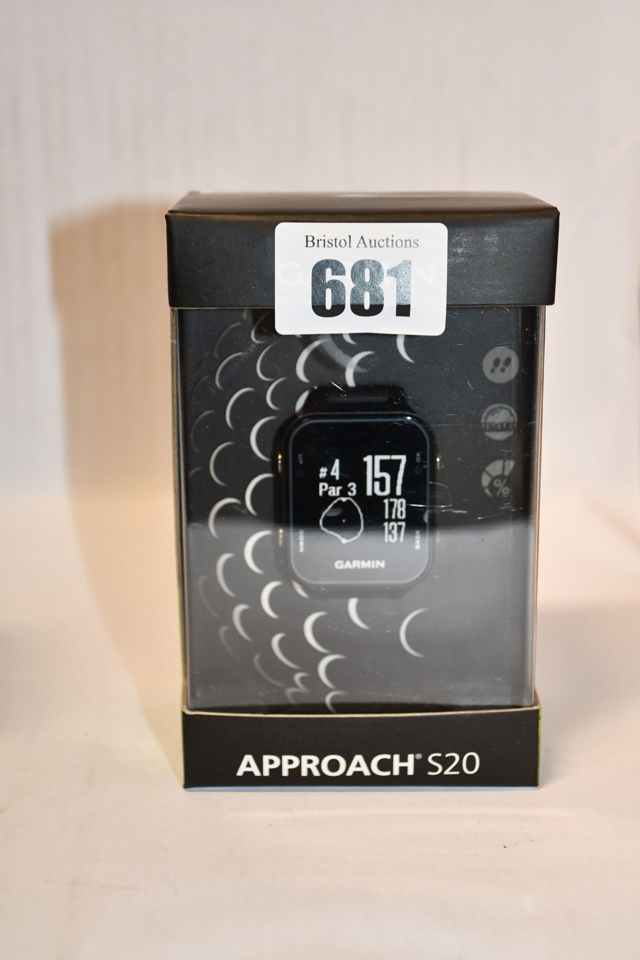 One man's boxed as new Garmin Approach S20 GPS golf watch with step tracking in black.