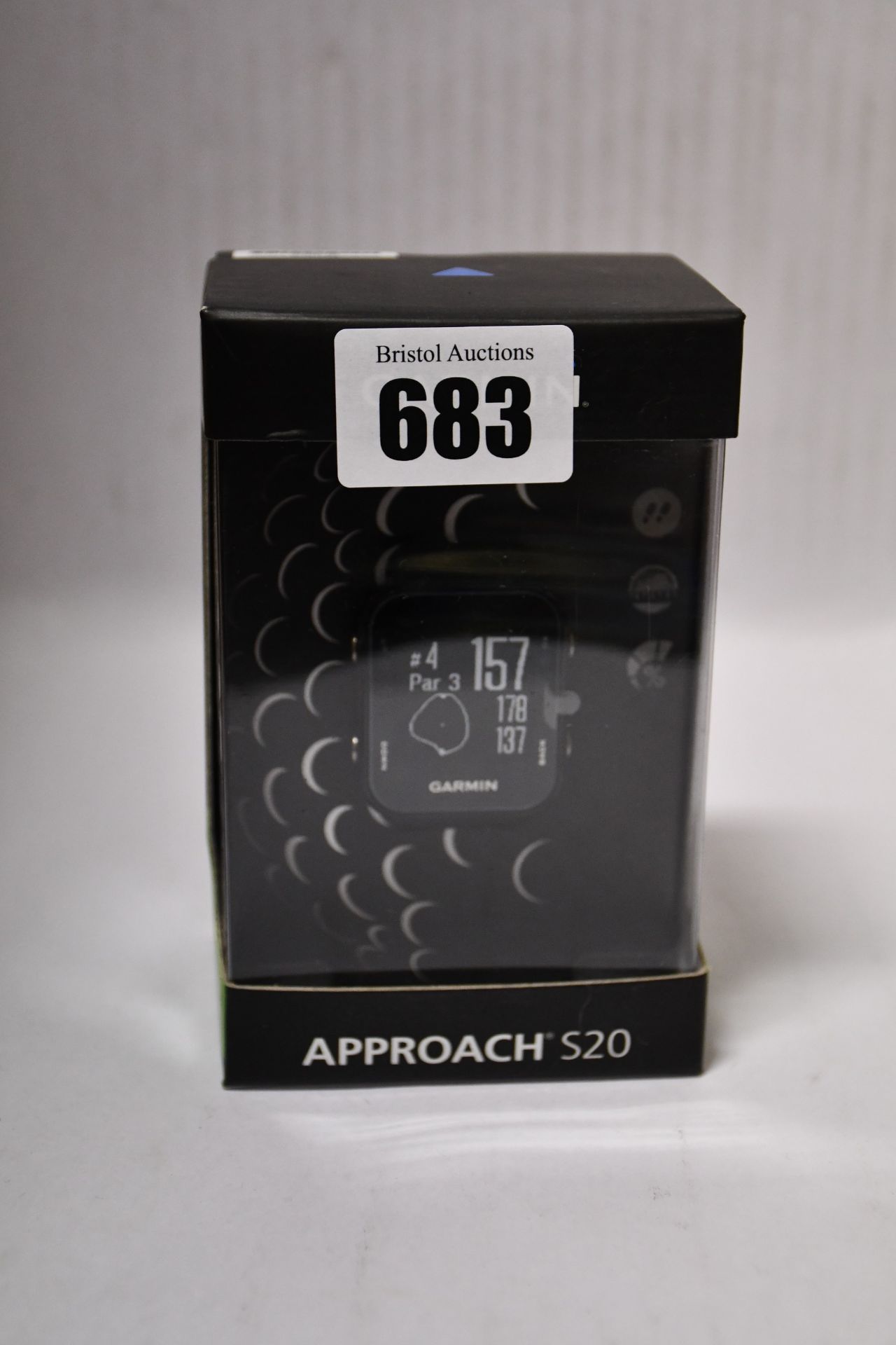 One man's boxed as new Garmin Approach S20 GPS golf watch with step tracking in black.