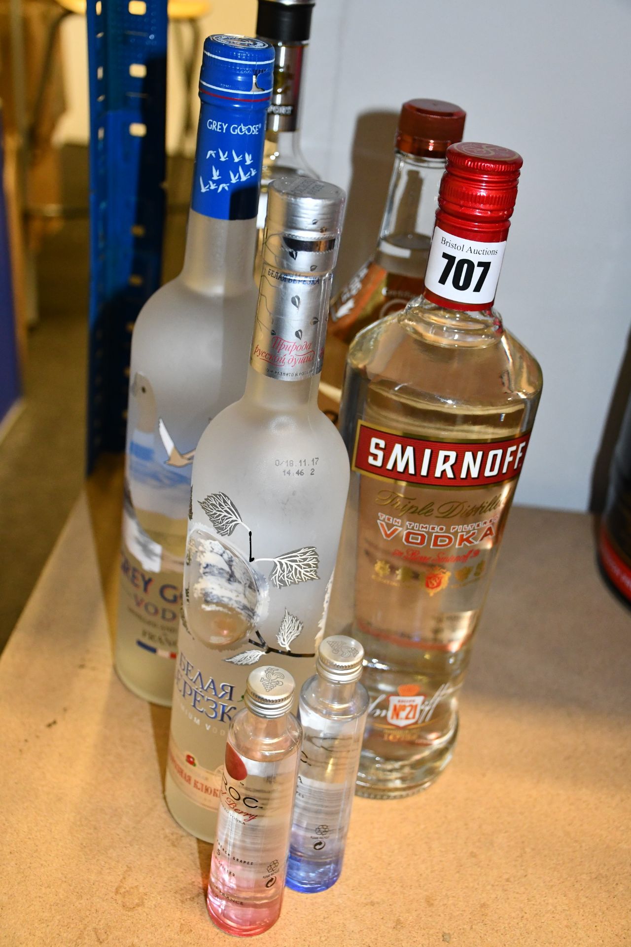 Five bottles of Vokda's to include Smirnoff, Grey goose, Tito's handmade and two mini bottles (