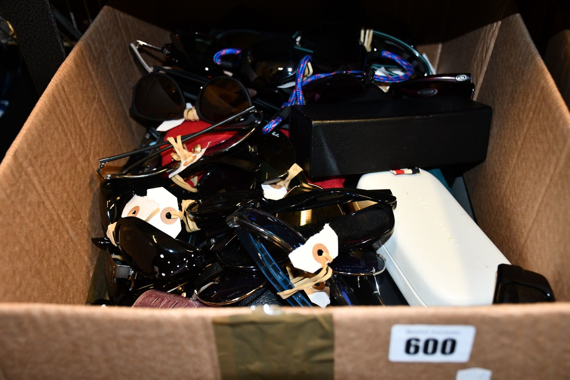 A box of unbranded sunglasses/glasses.