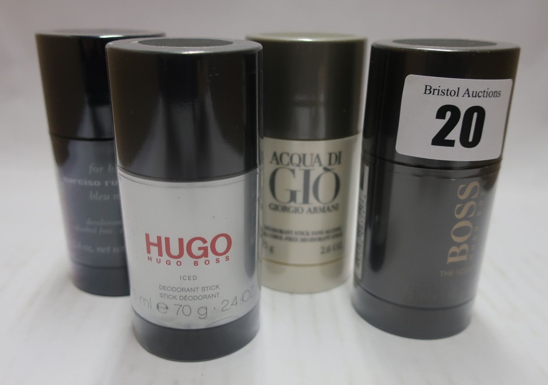 Four assorted deodorant sticks to include Hugo Boss, Acqua di Gio and Narciso Rodrigues.