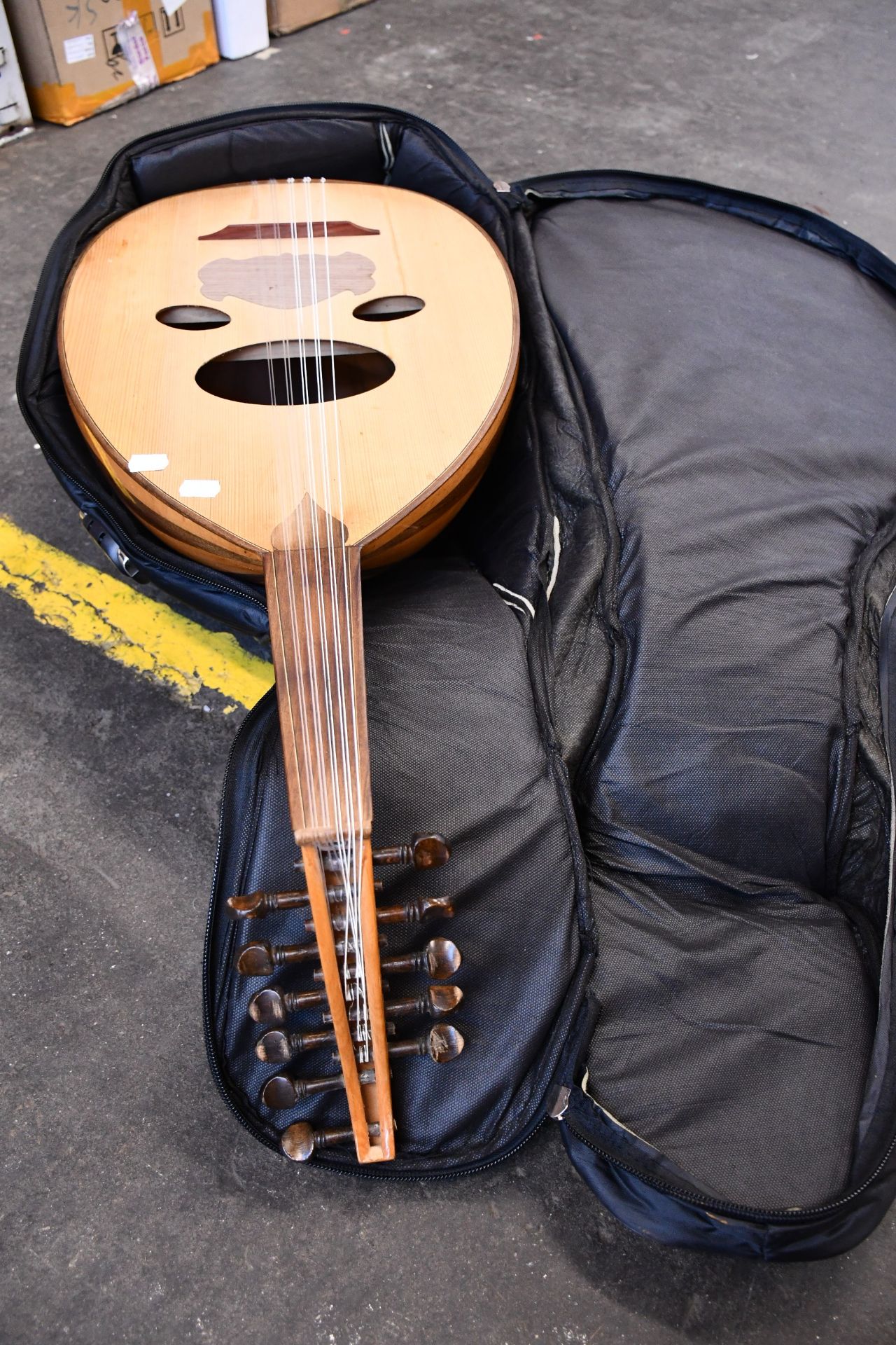 A pre owned dome shaped acoustic guitar with case.